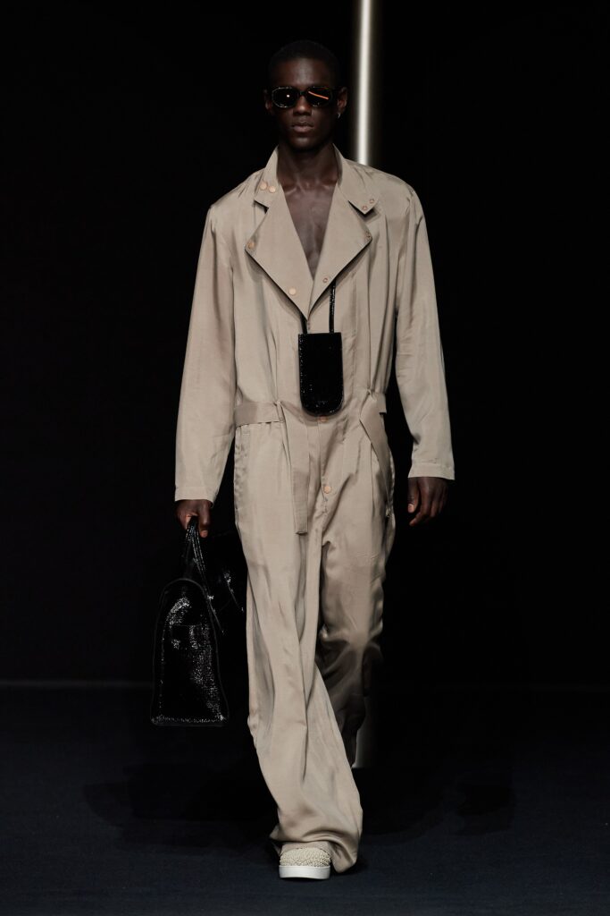 beige relaxed jumpsuit with black accessories