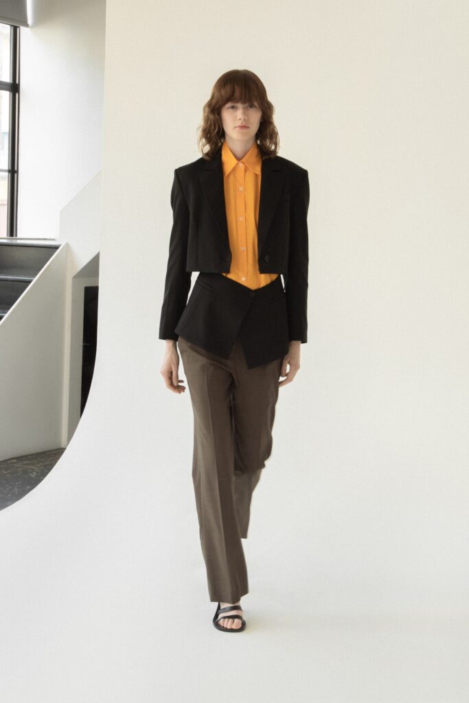 black blazer orange shirt brown pants