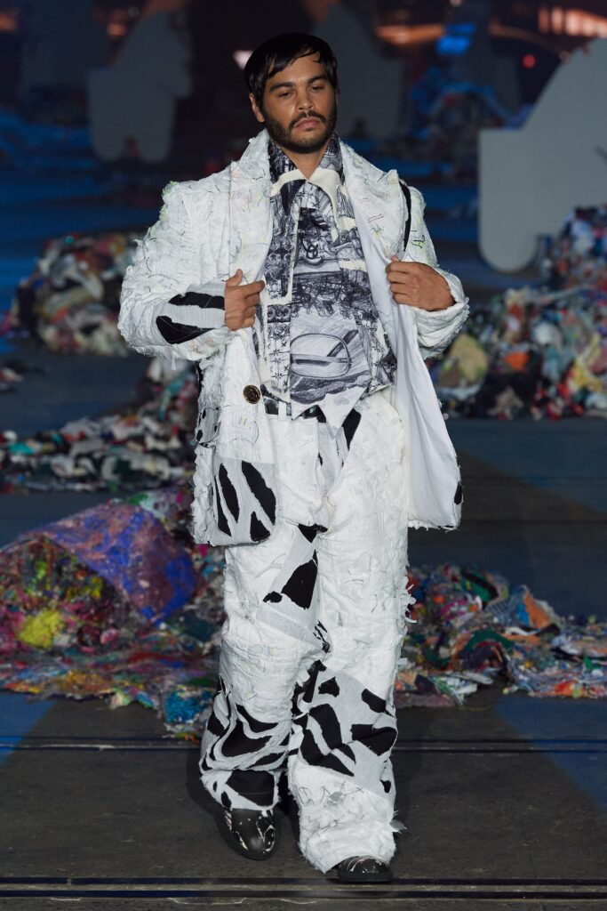 A relaxed fit suit featuring a printed design in black and white with long sleeves and a collared shirt.
