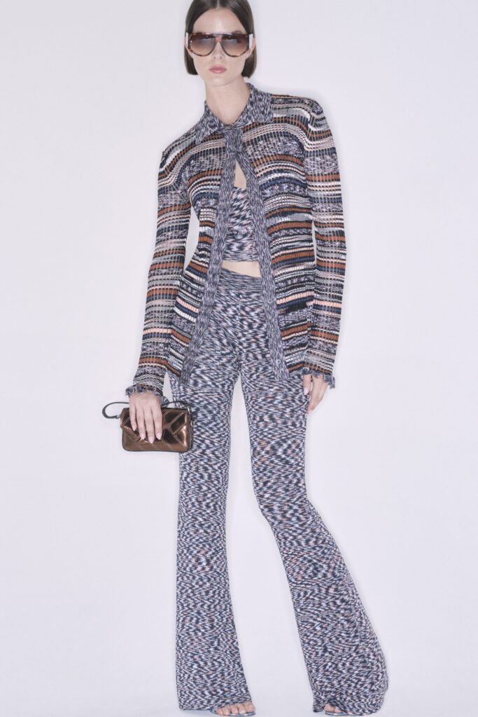 A fitted multicolor jacket with long sleeves and flared pants, showcasing a unique pattern.