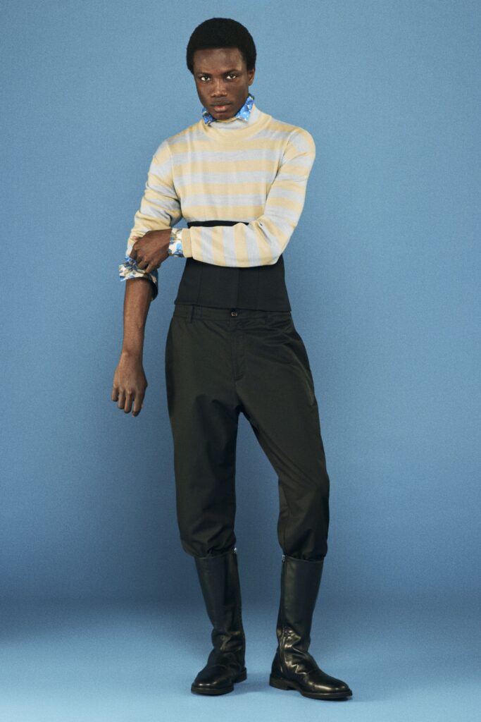 beige striped fitted sweater with black pants