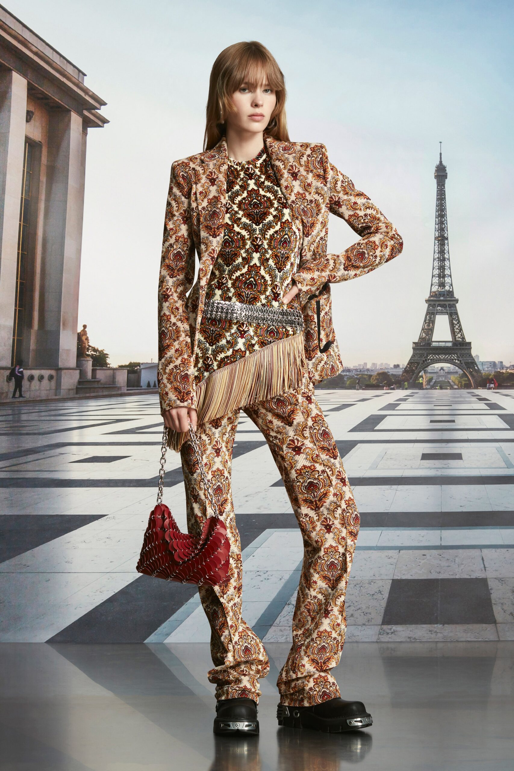A fitted multicolor silk suit with long sleeves and flared pants, featuring intricate embroidery.