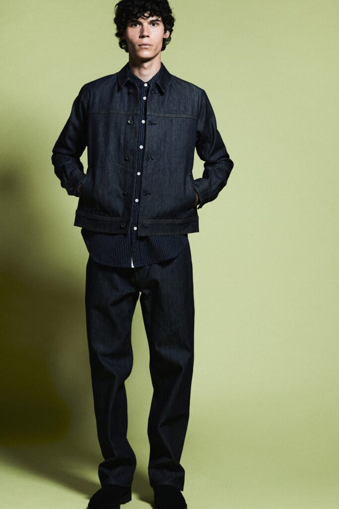 A relaxed blue denim jacket with a collared design paired with straight-leg denim pants.