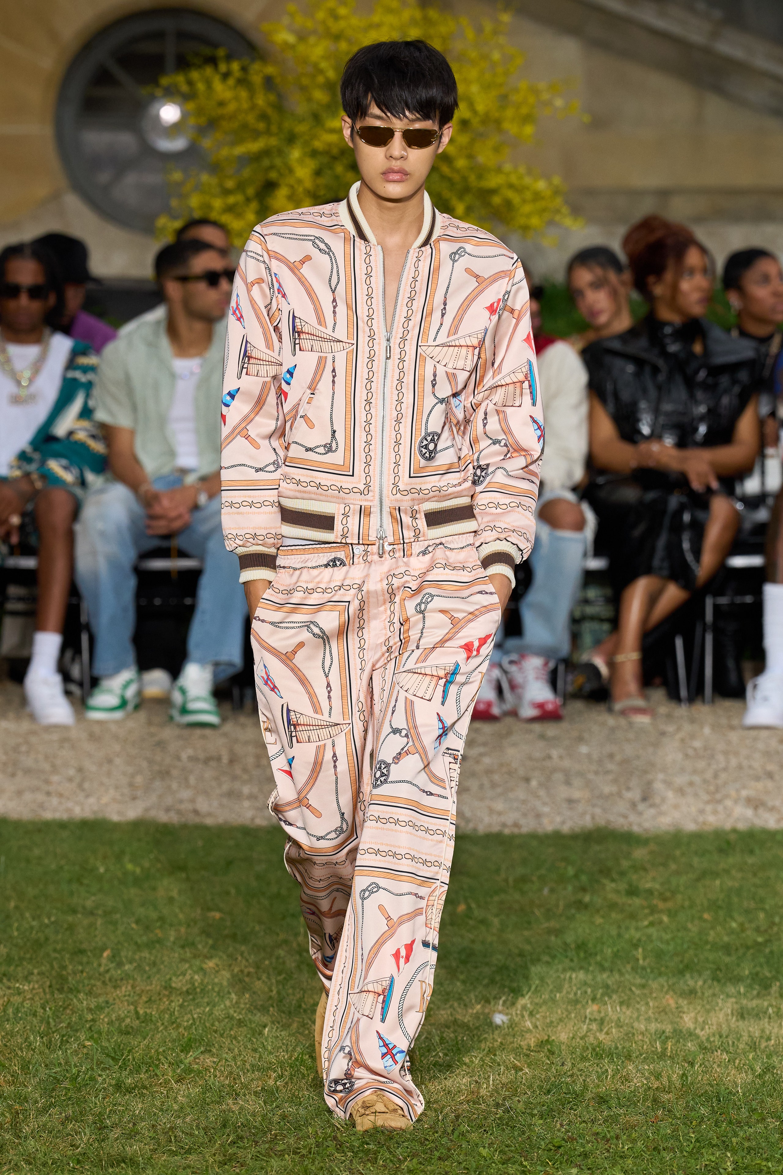 A relaxed fit beige printed jacket paired with matching pants, featuring a collared neckline.