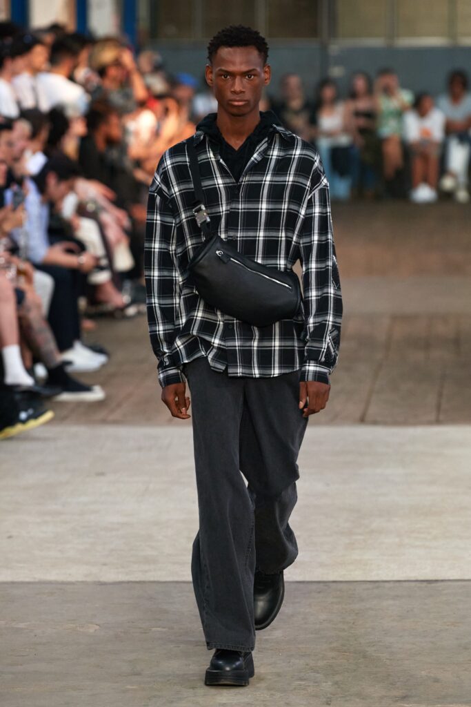 A relaxed black and white checked long-sleeve shirt paired with relaxed-fit pants.
