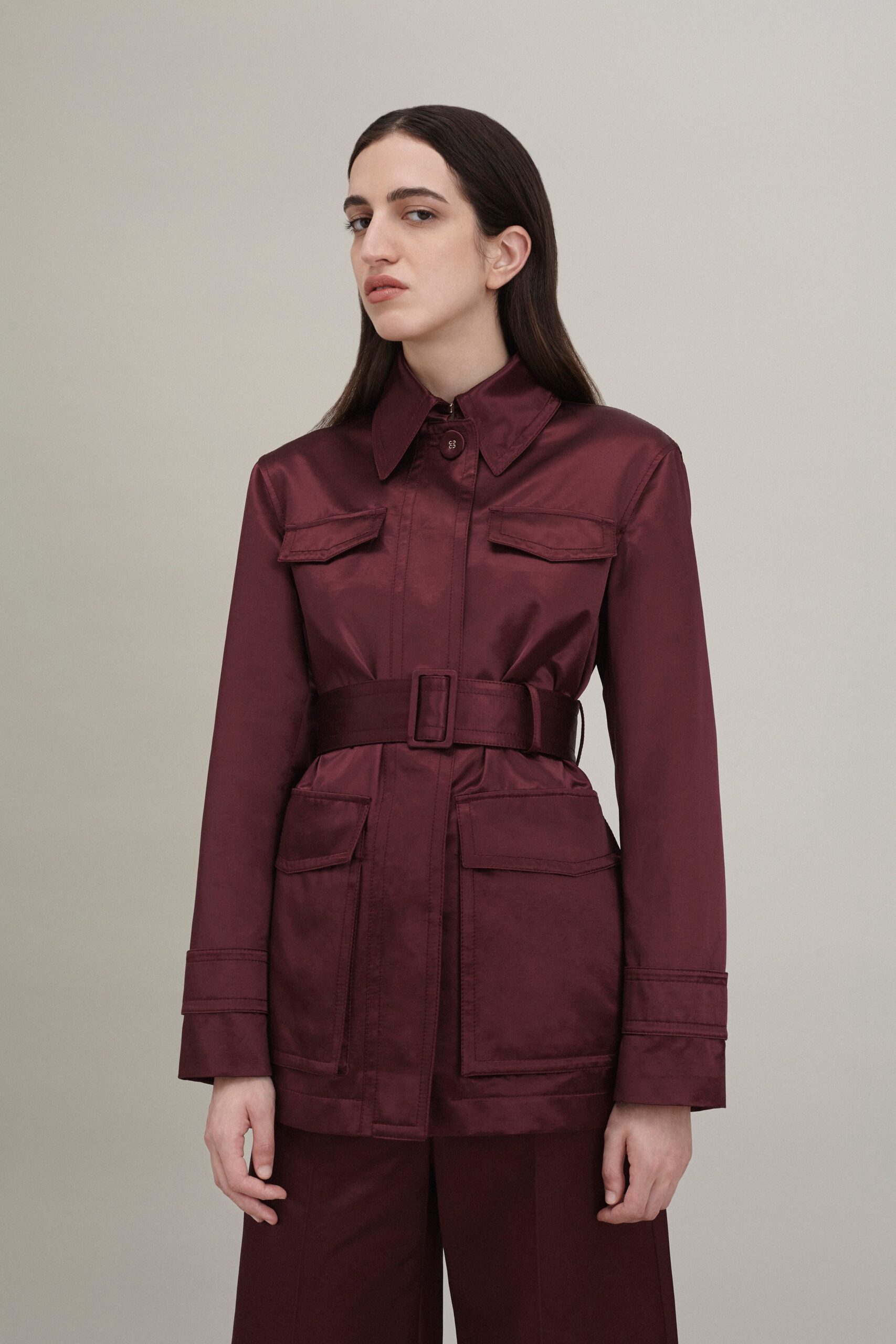 maroon silk fitted jacket and relaxed pants