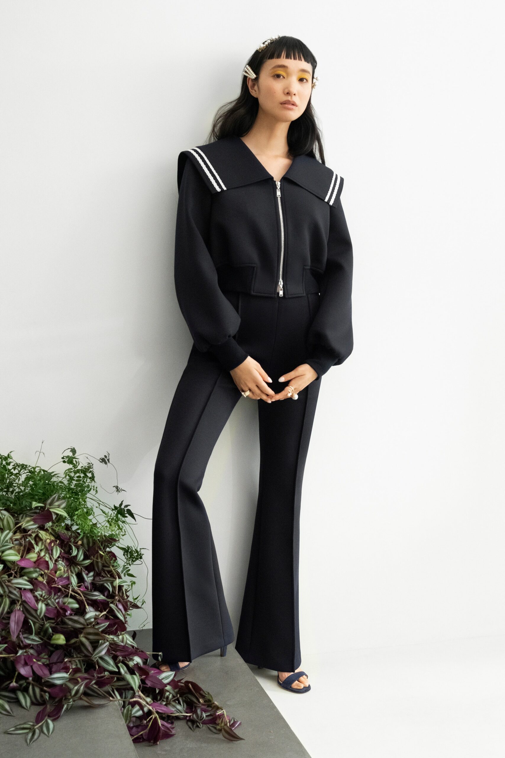 black fitted jacket and flared pants