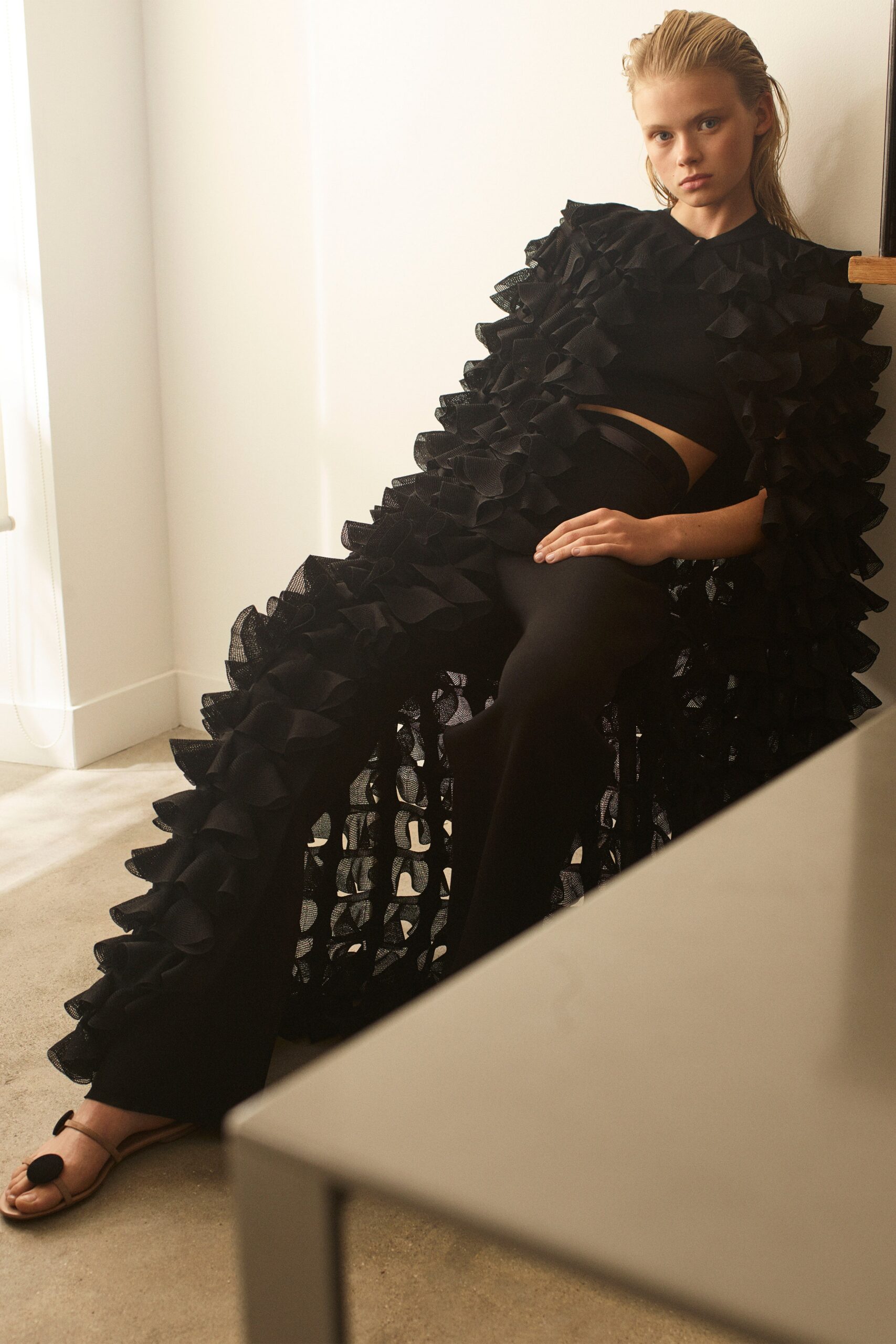 black ruffled top and cape