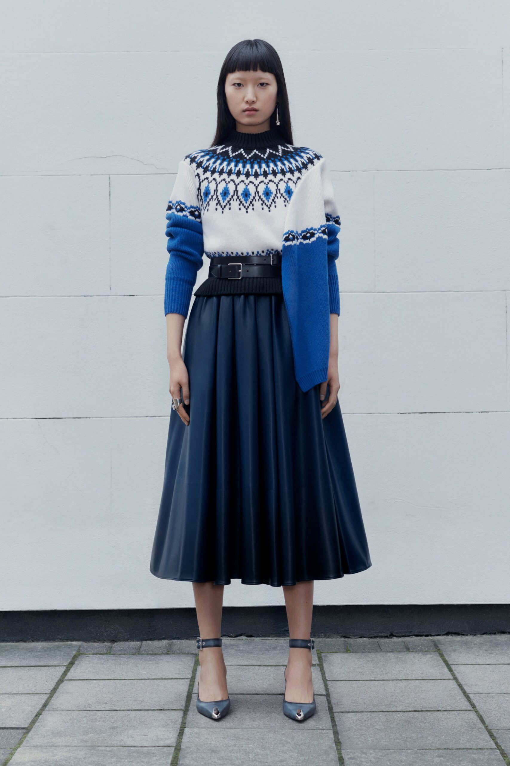white blue wool sweater with black leather skirt