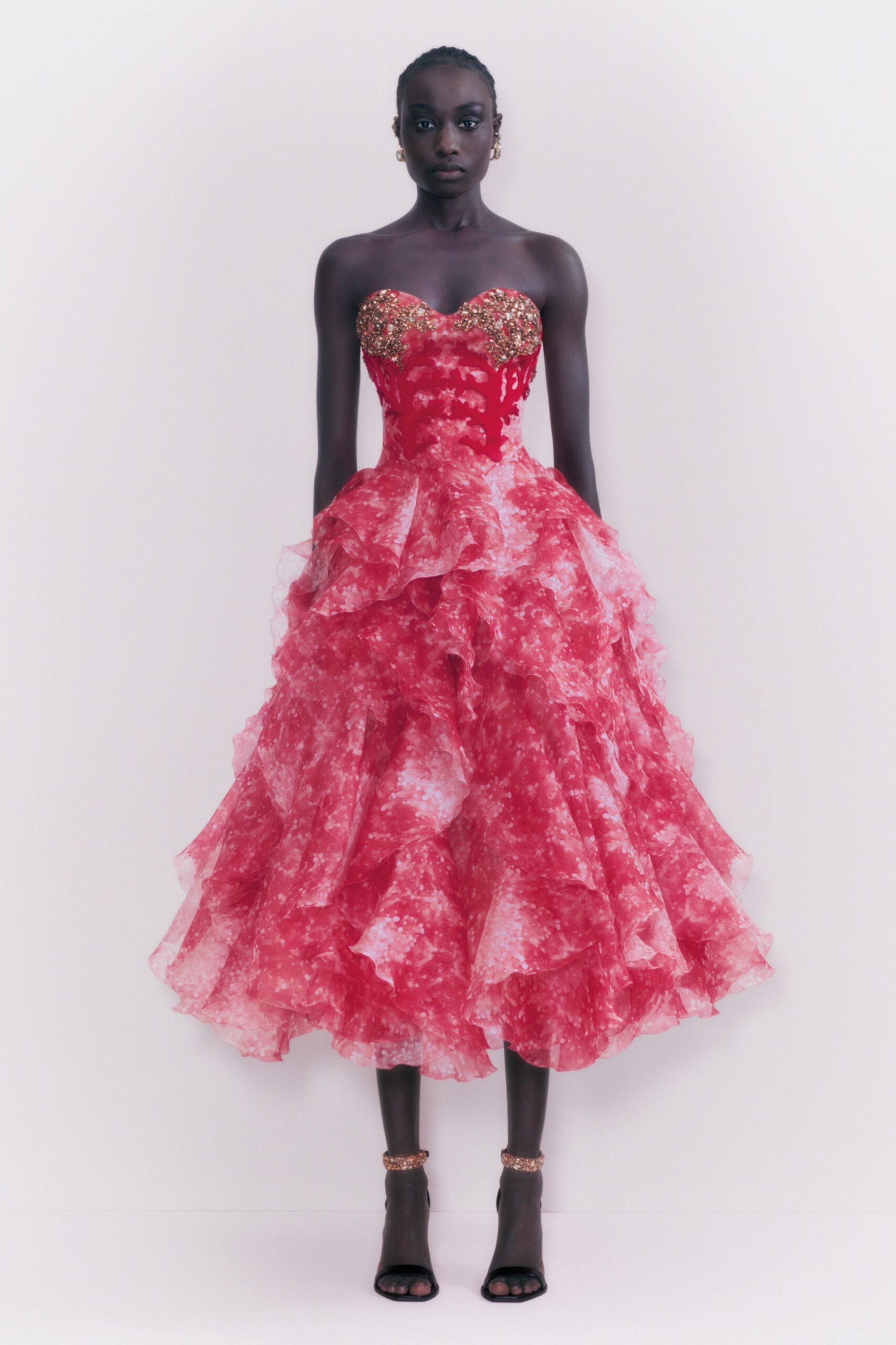 red strapless ruffled gown