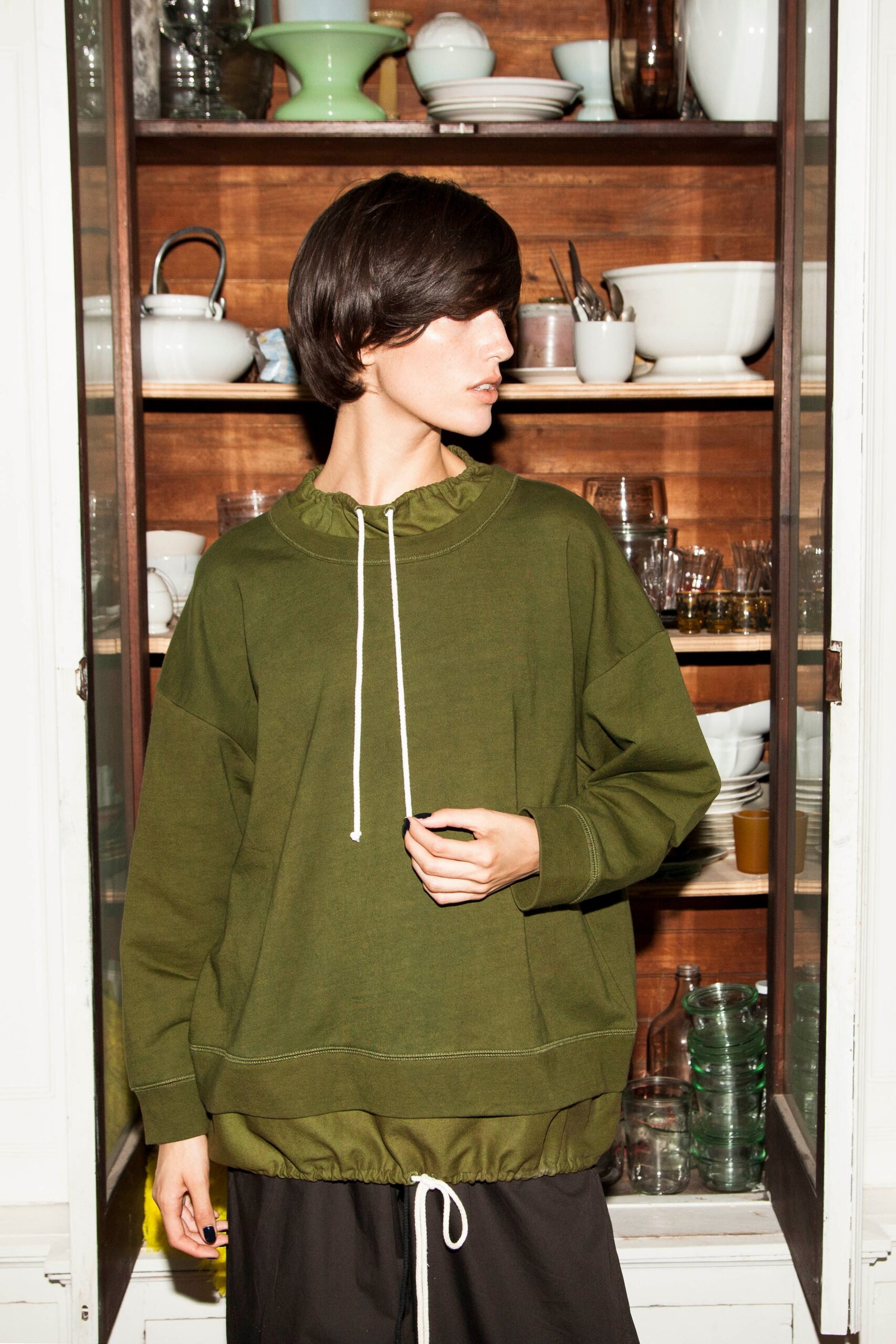 oversized green hoodie and black pants