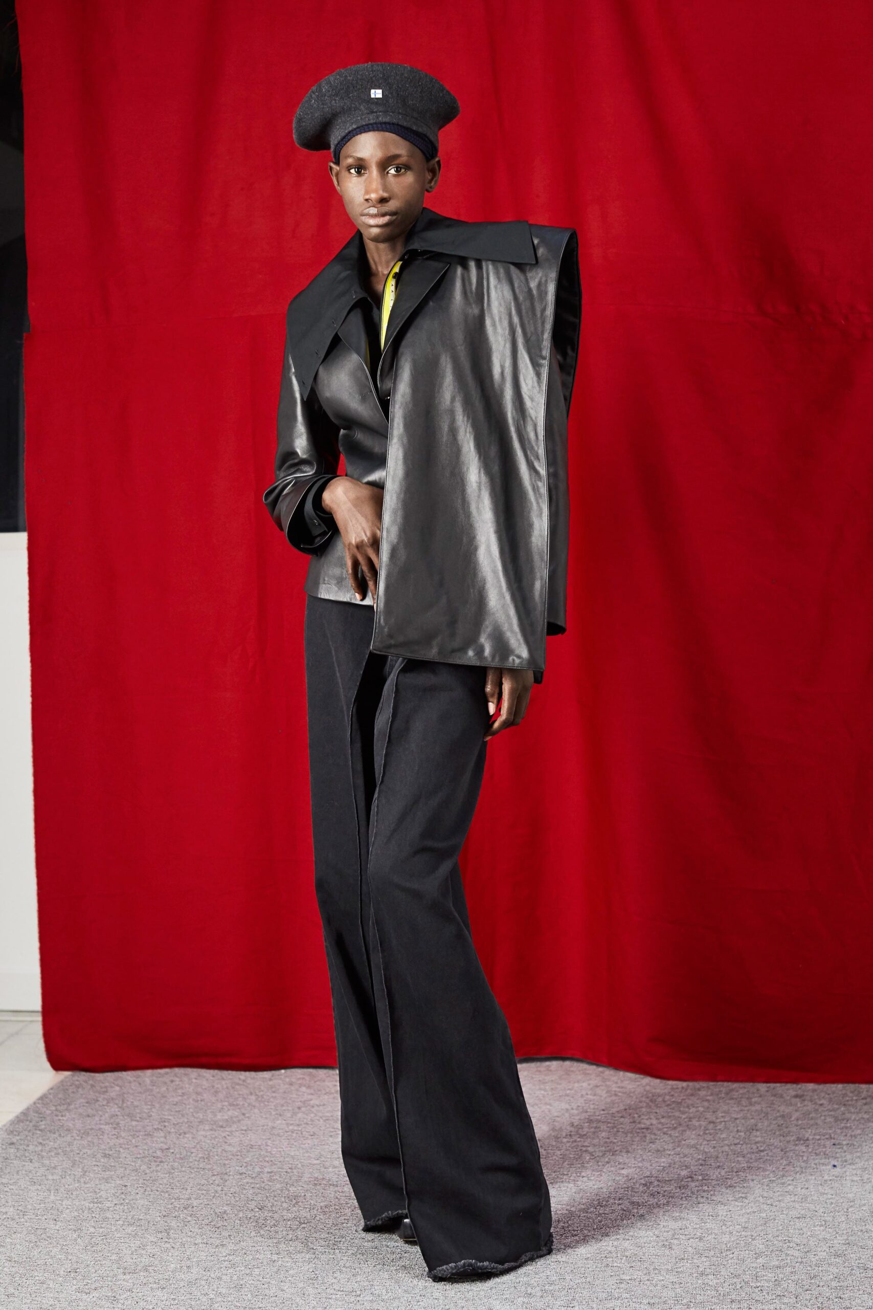 black leather asymmetric jacket and wide-leg pants