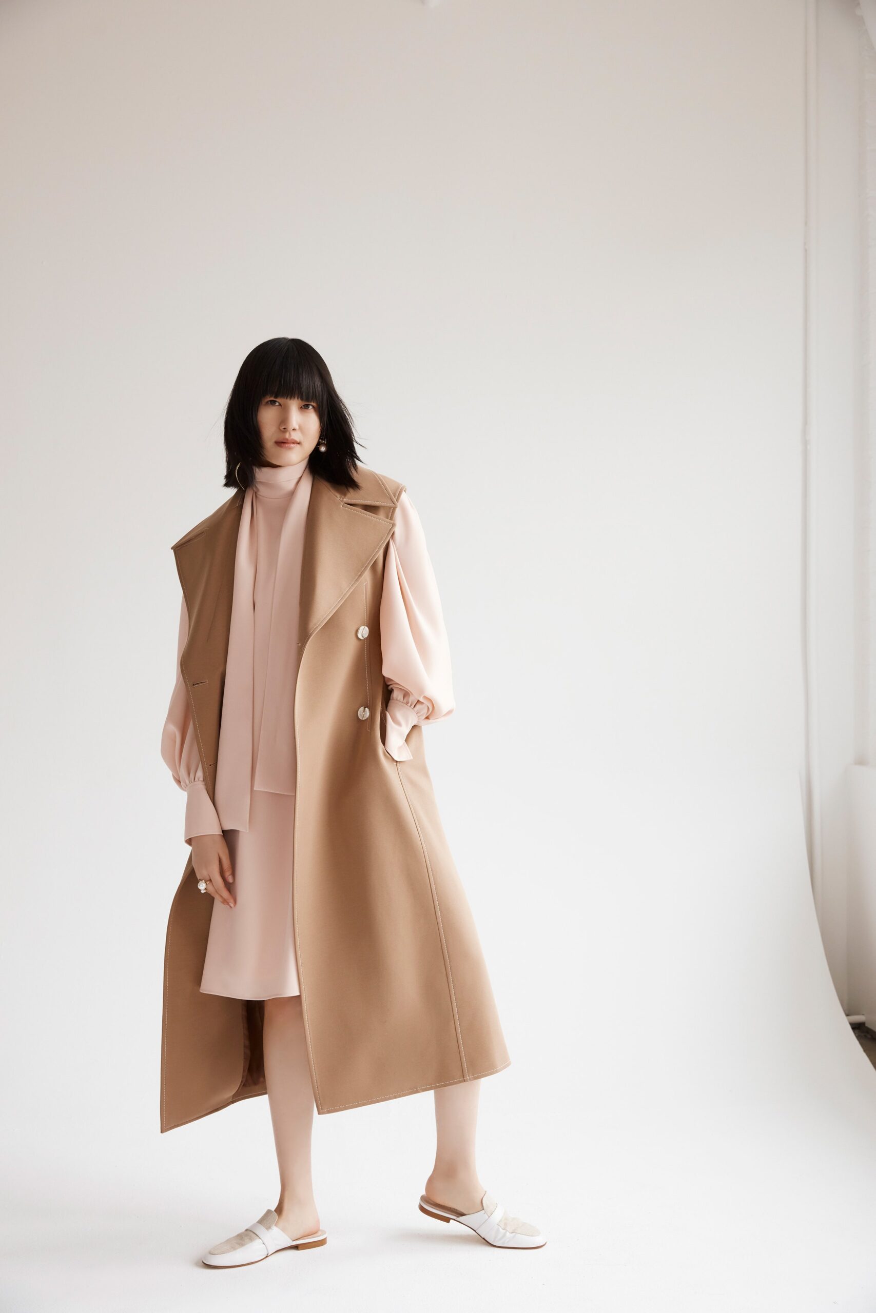 brown coat and pink dress