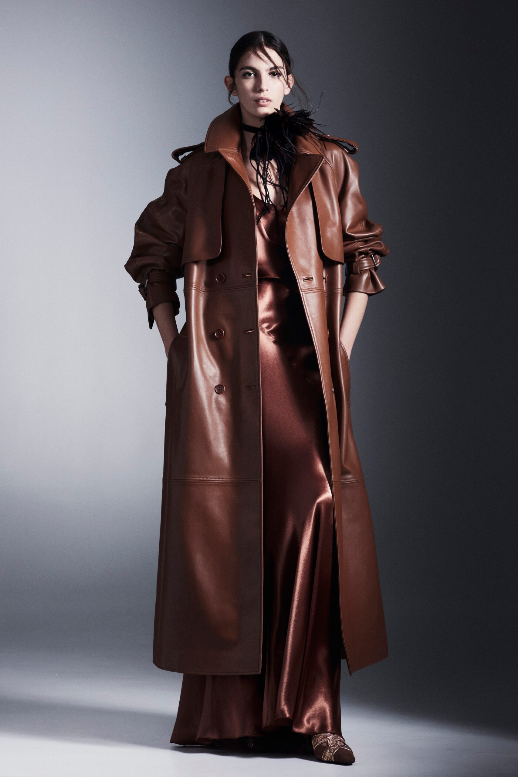 brown leather coat and silk gown