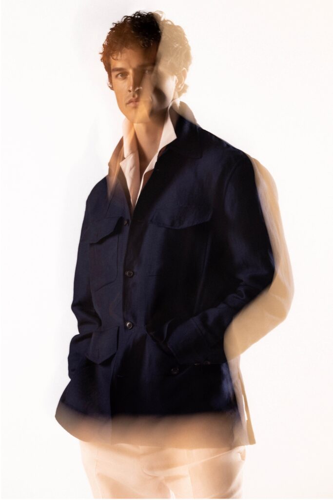 A relaxed blue cotton jacket with long sleeves and a collared design.