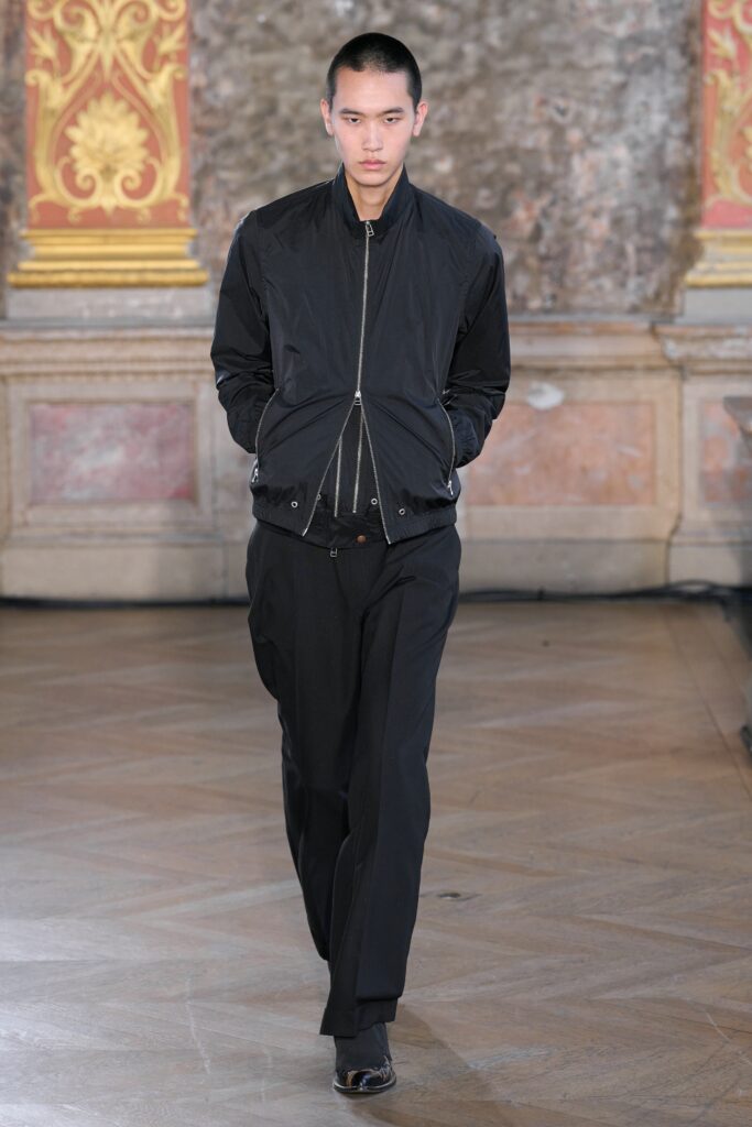 black fitted jacket and relaxed pants