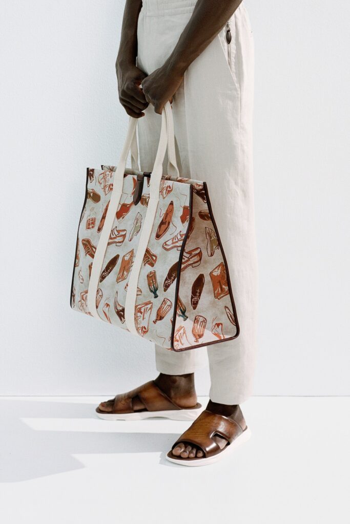 A pair of relaxed beige cotton pants with a straight-leg design.