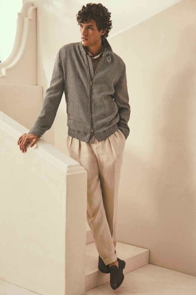 A relaxed gray checked jacket paired with beige linen pants for a stylish look.