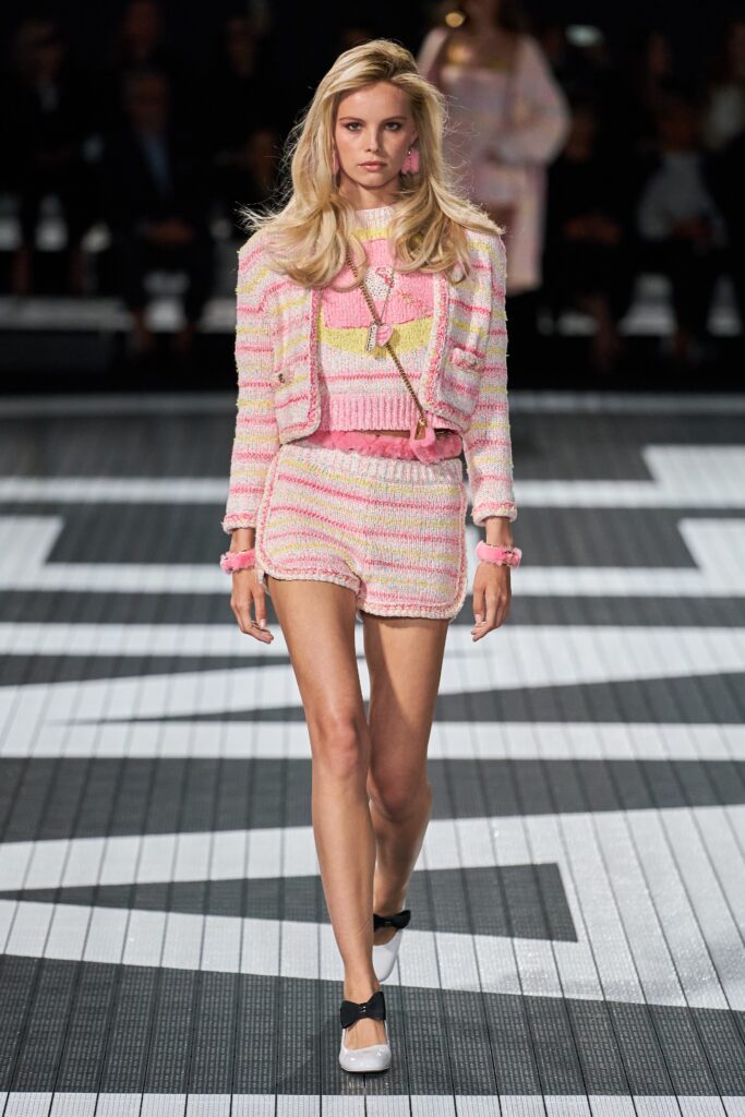 A fitted pink and white striped top with short sleeves paired with matching shorts.