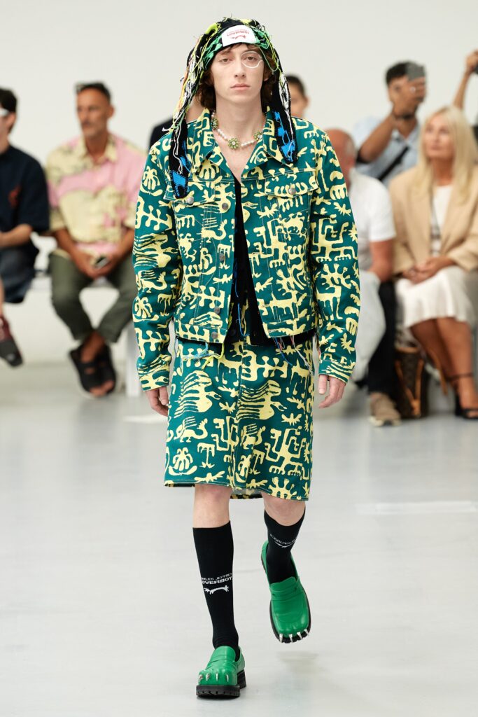 A relaxed-fit green printed jacket paired with matching shorts for a bold runway look.