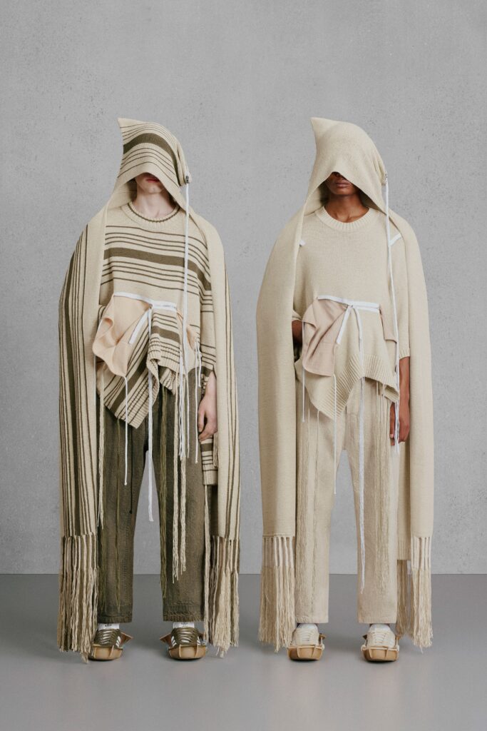 beige wool poncho and gray pants