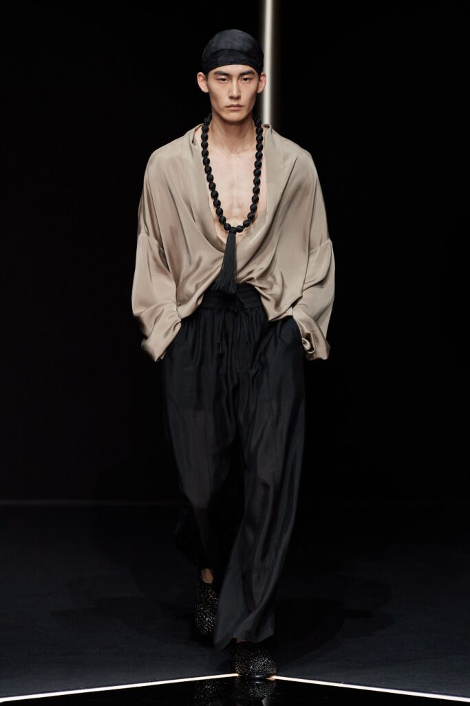 beige silk relaxed shirt and black silk pants