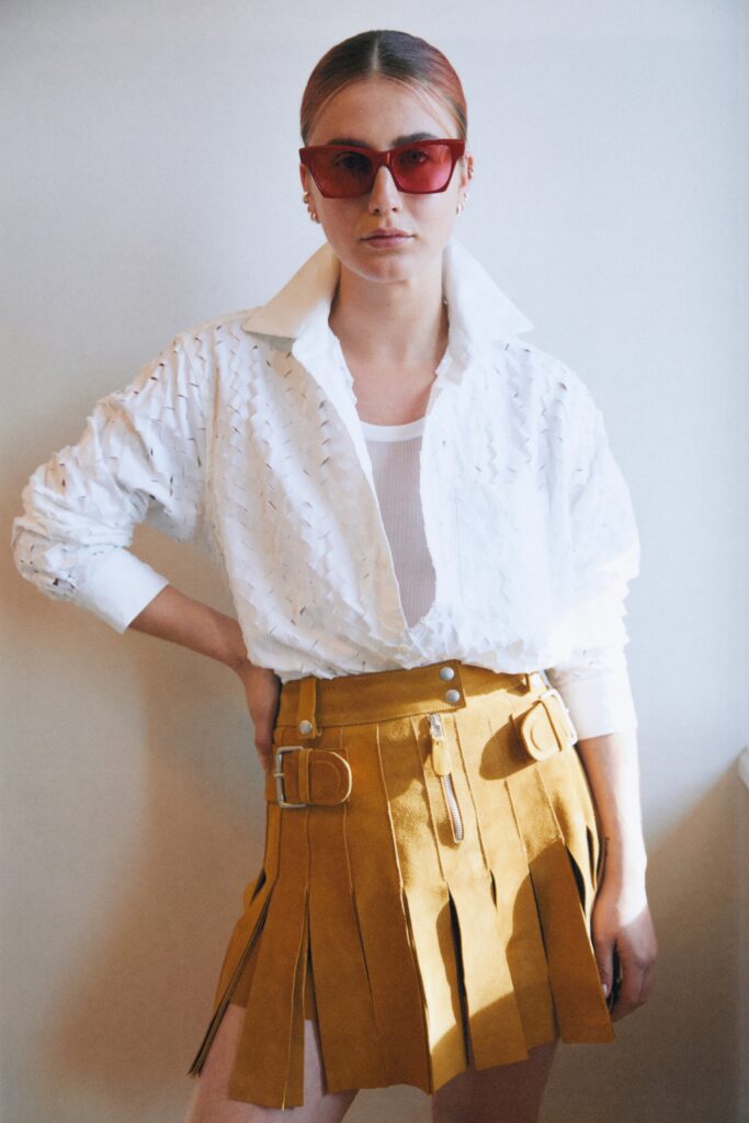 white relaxed blouse and yellow skirt