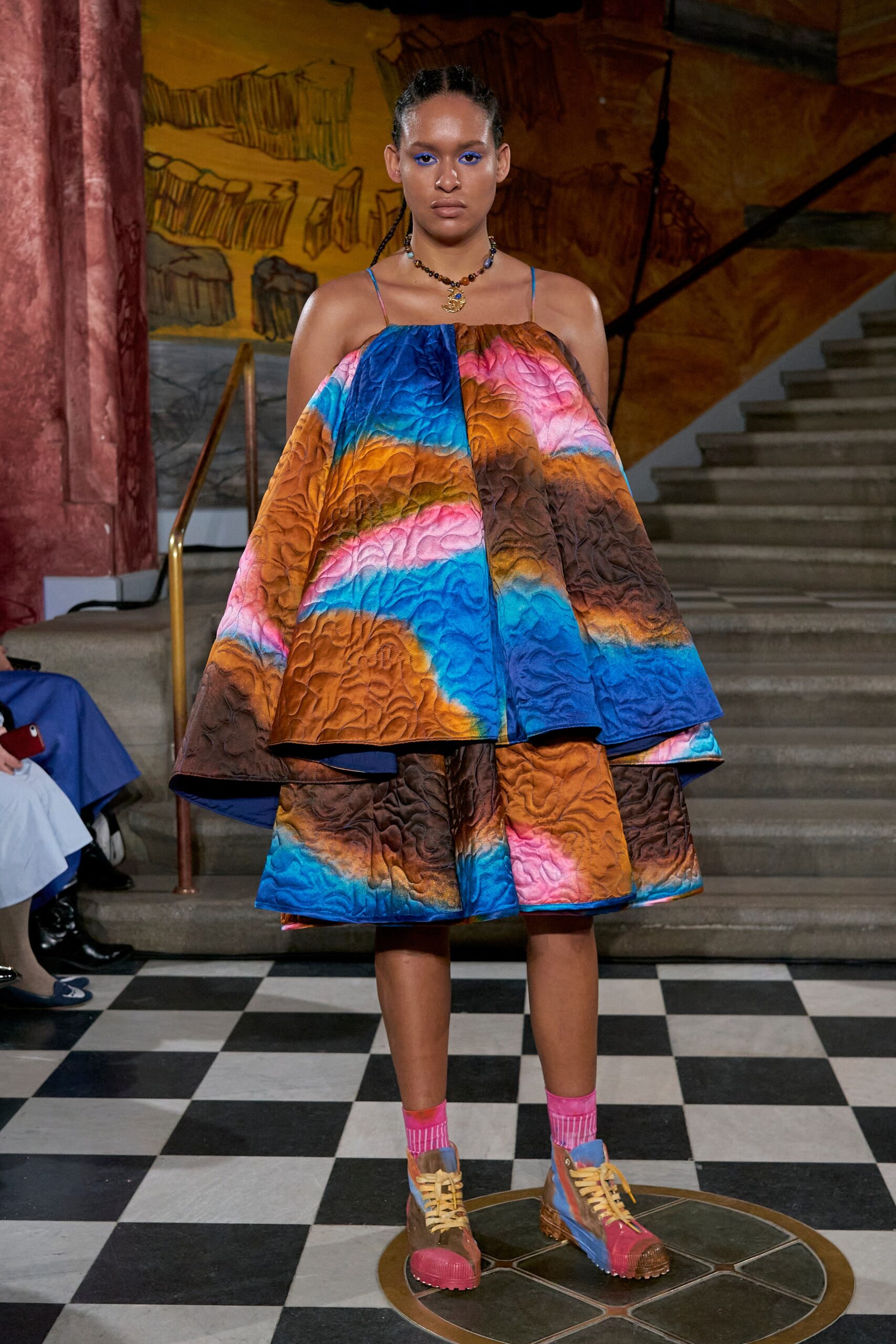 A relaxed multicolor sleeveless dress with a high neckline and tiered design.