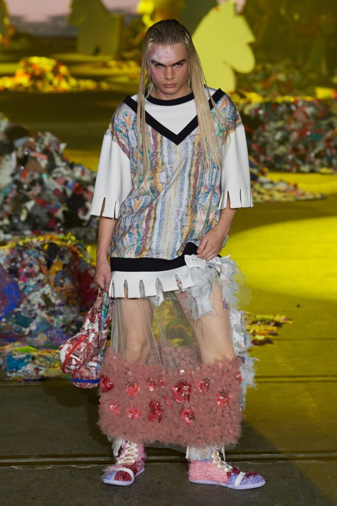 A relaxed multicolor dress with a V-neckline and short sleeves featuring an asymmetric layered design.