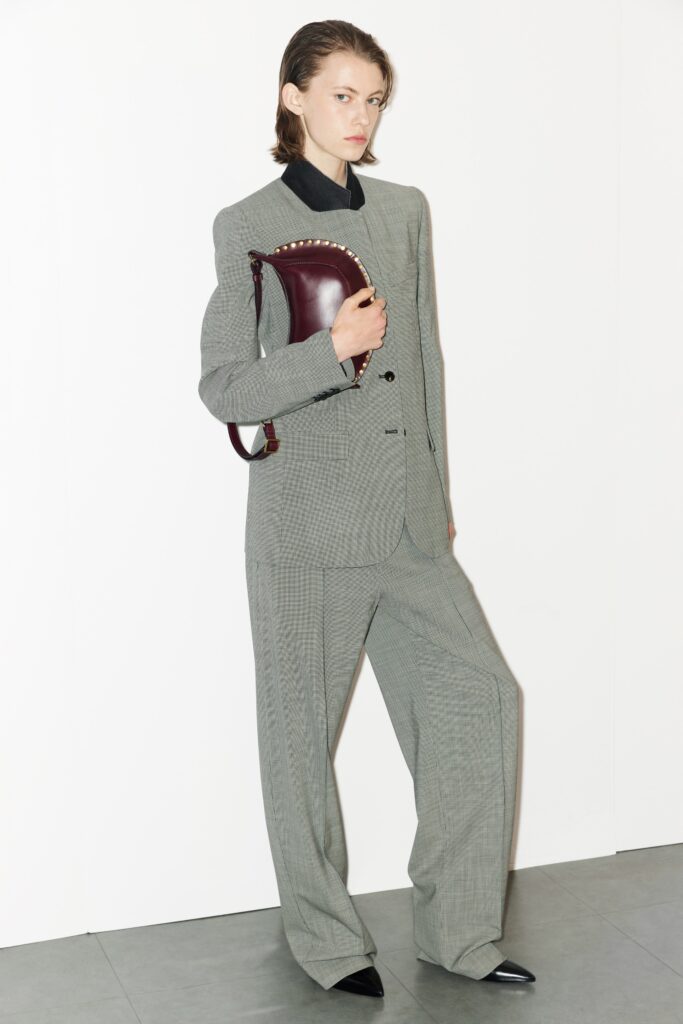 A relaxed gray checked suit with a collared long-sleeve shirt.