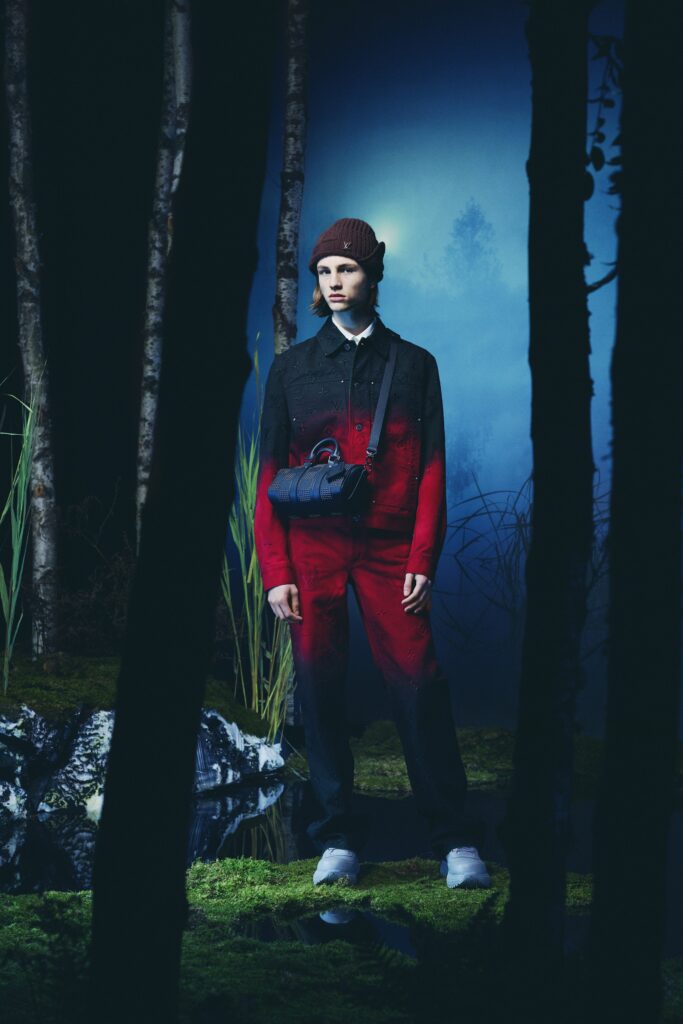 A relaxed-fit color-blocked black and red jacket with long sleeves and a collared design.