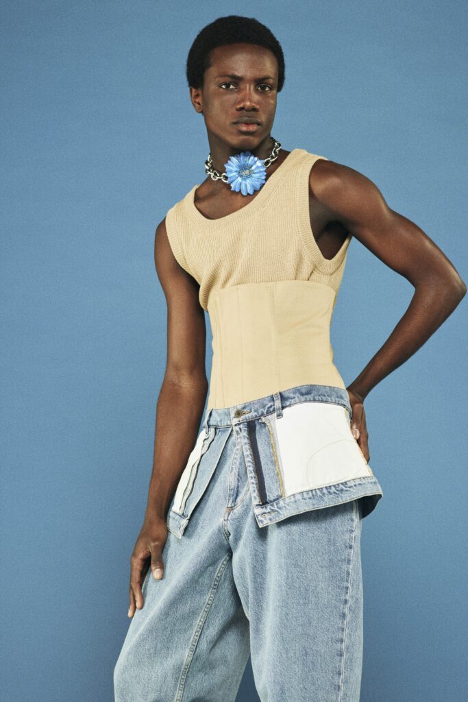 beige fitted top and blue relaxed pants