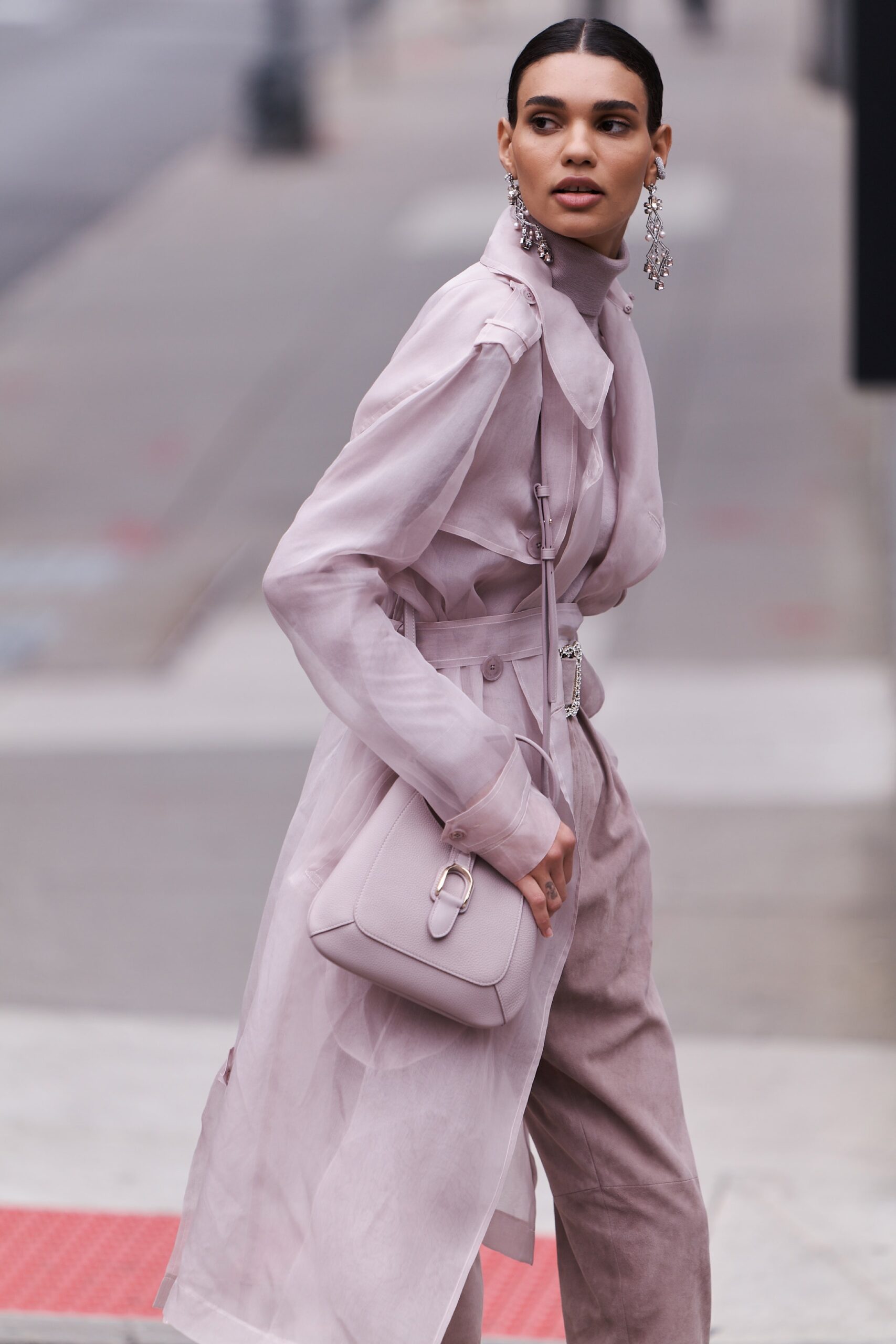 A relaxed pink silk belted coat with long sleeves and a collared design.