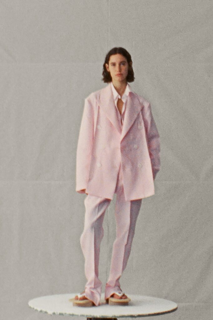 An oversized pink cotton suit featuring long sleeves and a double-breasted design.