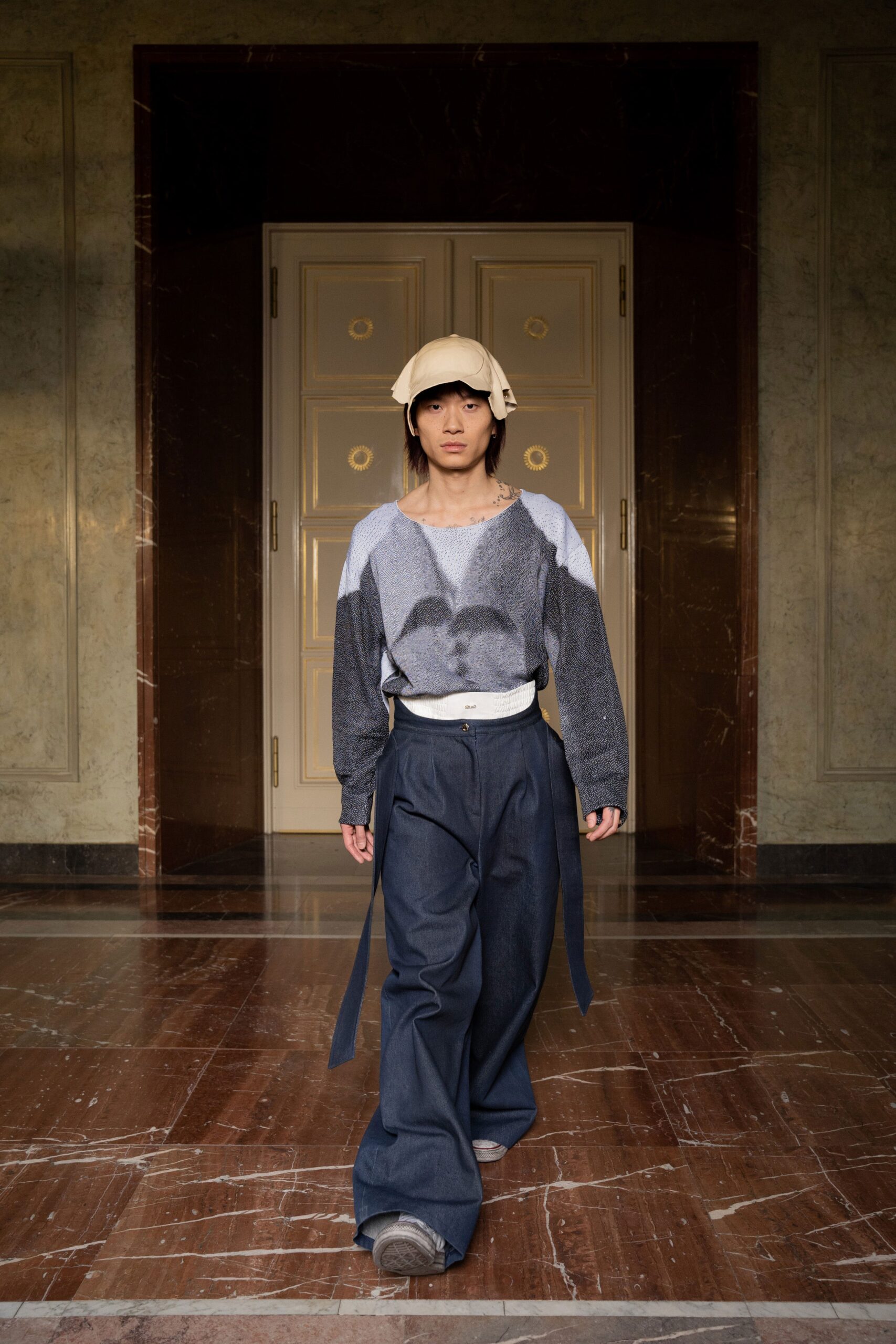 A relaxed blue denim long-sleeve top paired with wide-leg pants for a casual look.