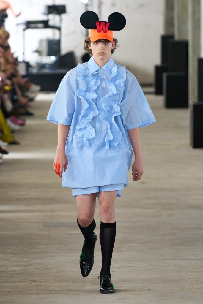 A relaxed blue cotton shirt with ruffles and matching shorts, featuring a collared neckline.