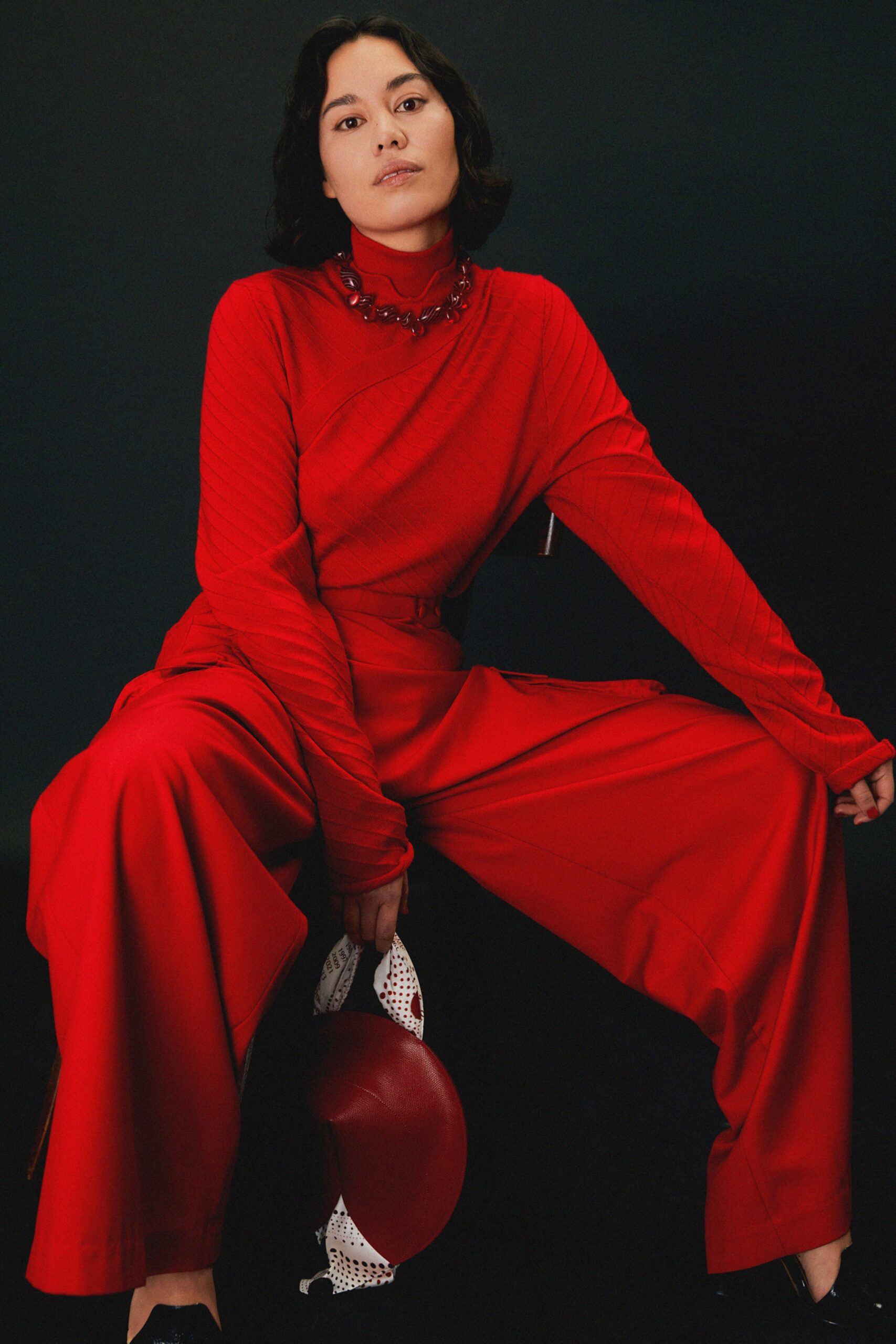 red fitted top and wide-leg pants