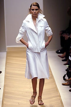 white fitted jacket and midi skirt