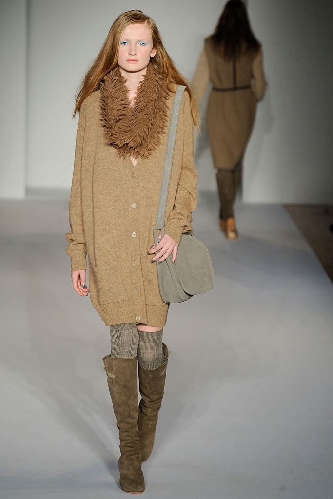 A relaxed beige wool dress with long sleeves and a collared buttoned cardigan.