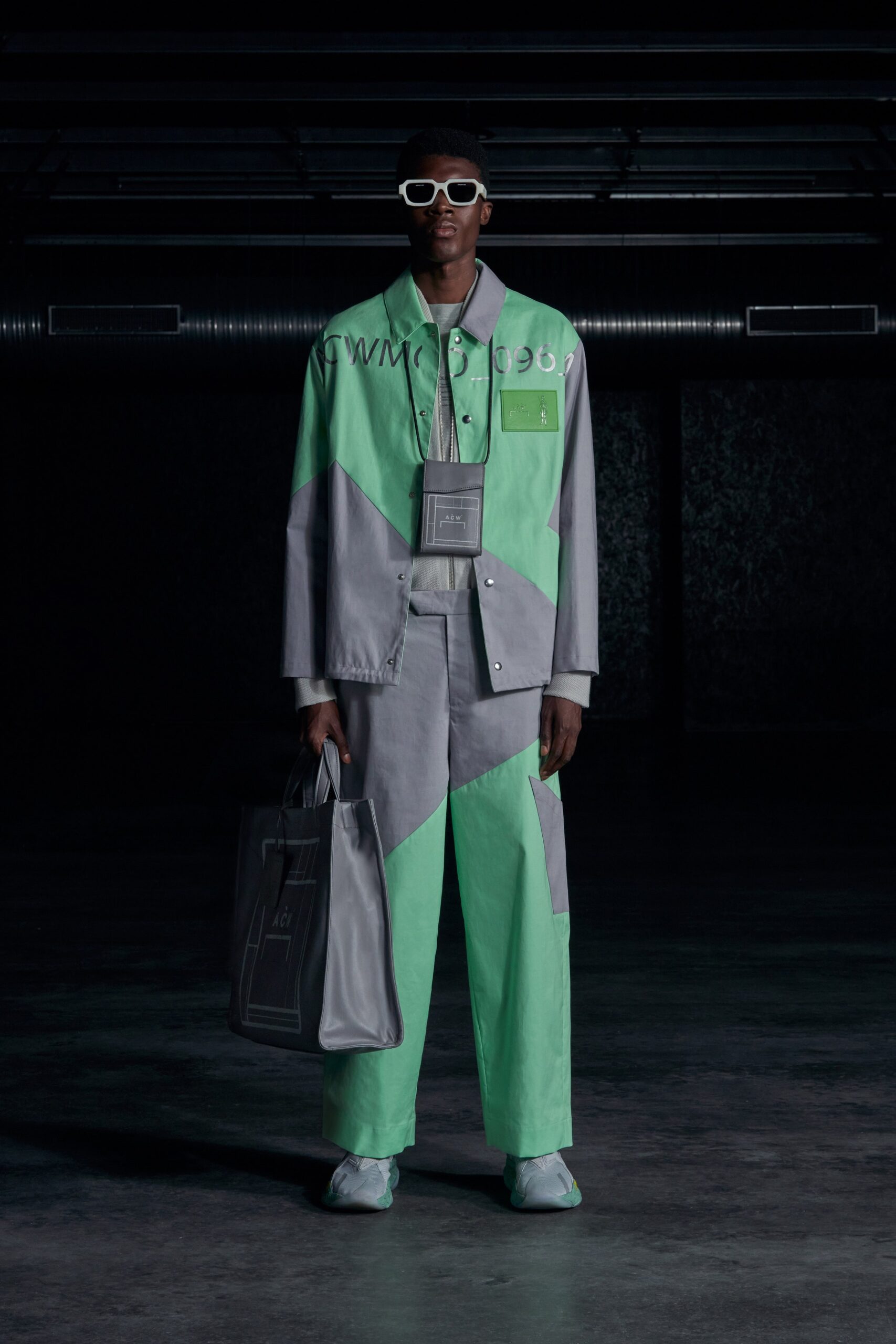 A relaxed-fit green and gray color-blocked jacket paired with matching pants.