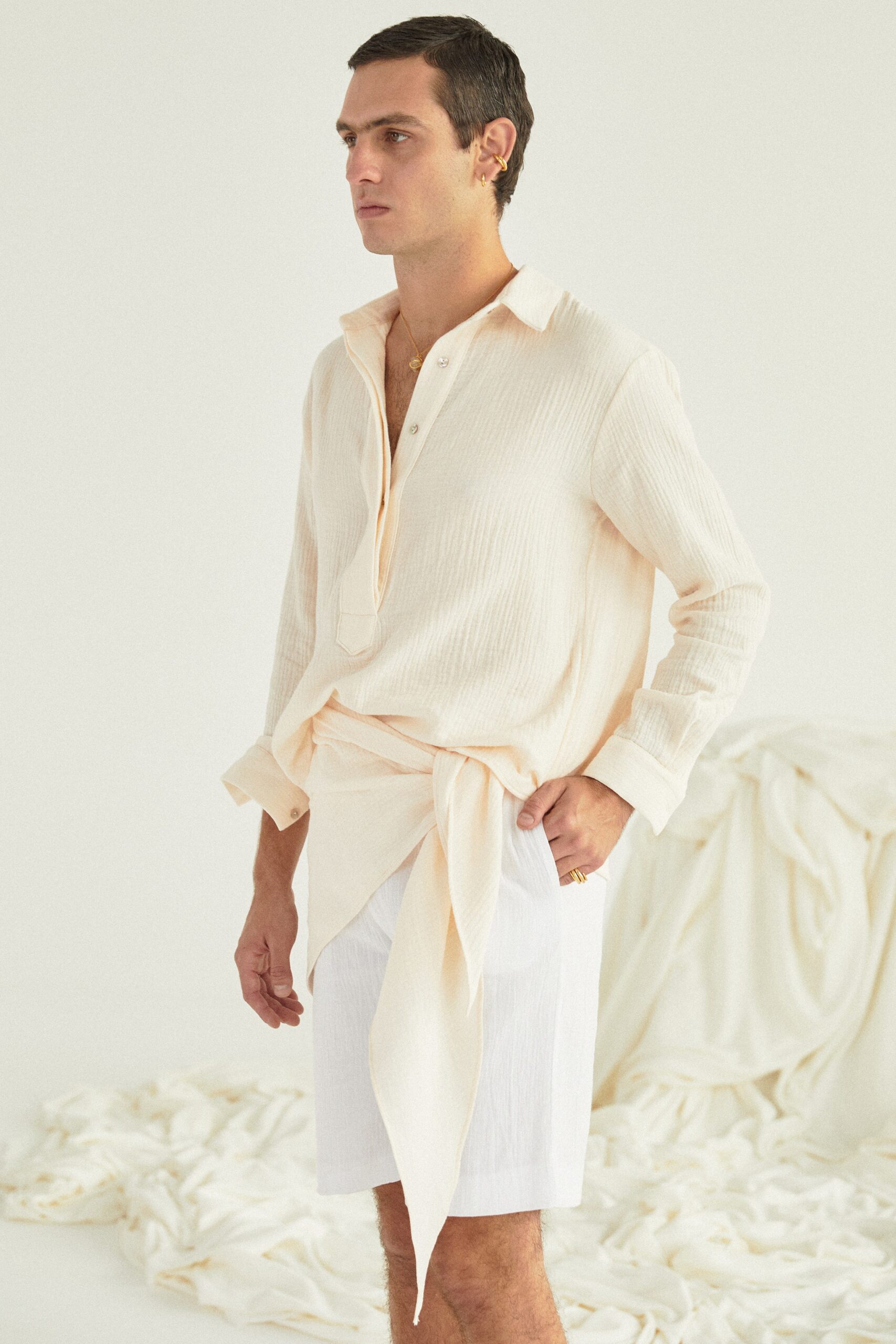 beige cotton shirt and white shorts