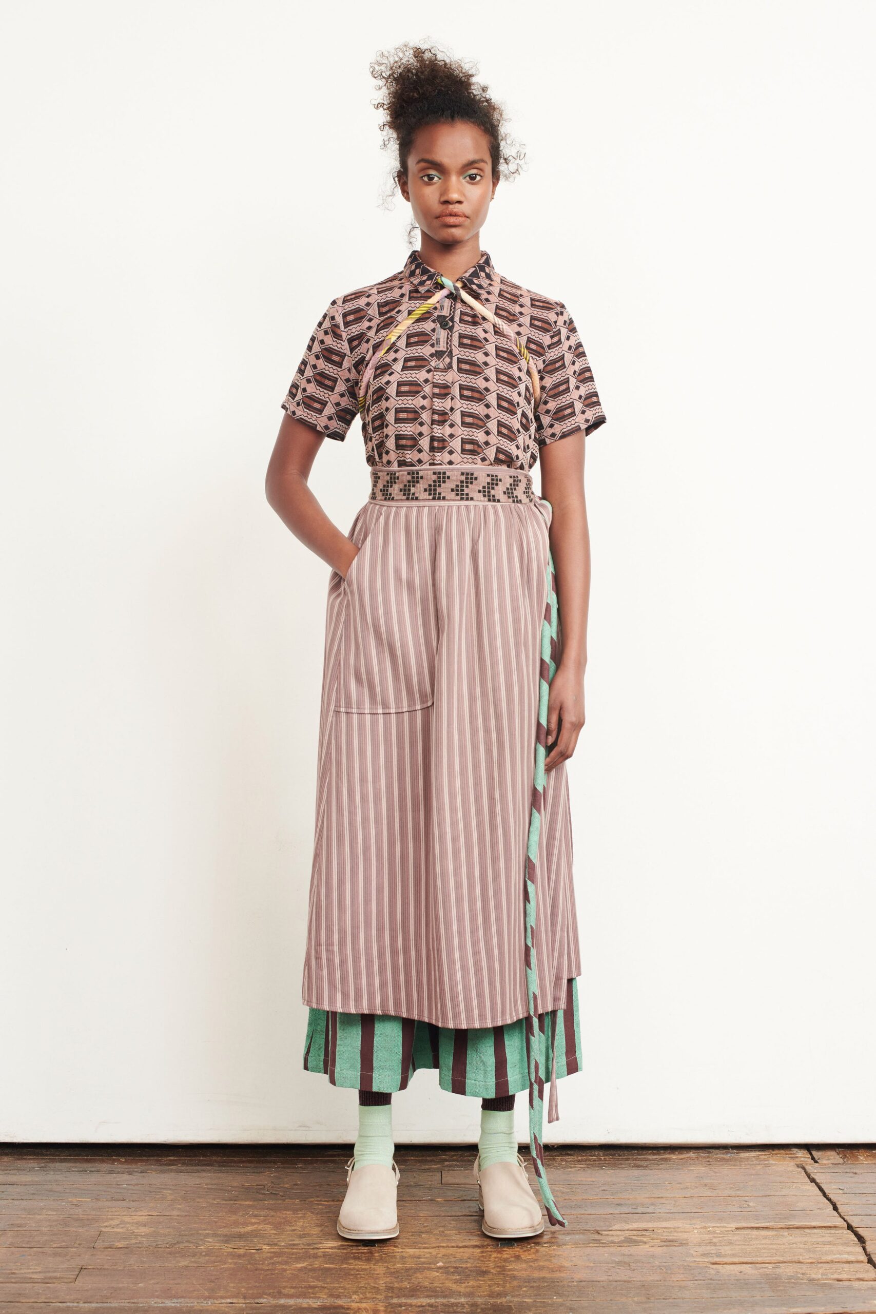 printed shirt and striped skirt