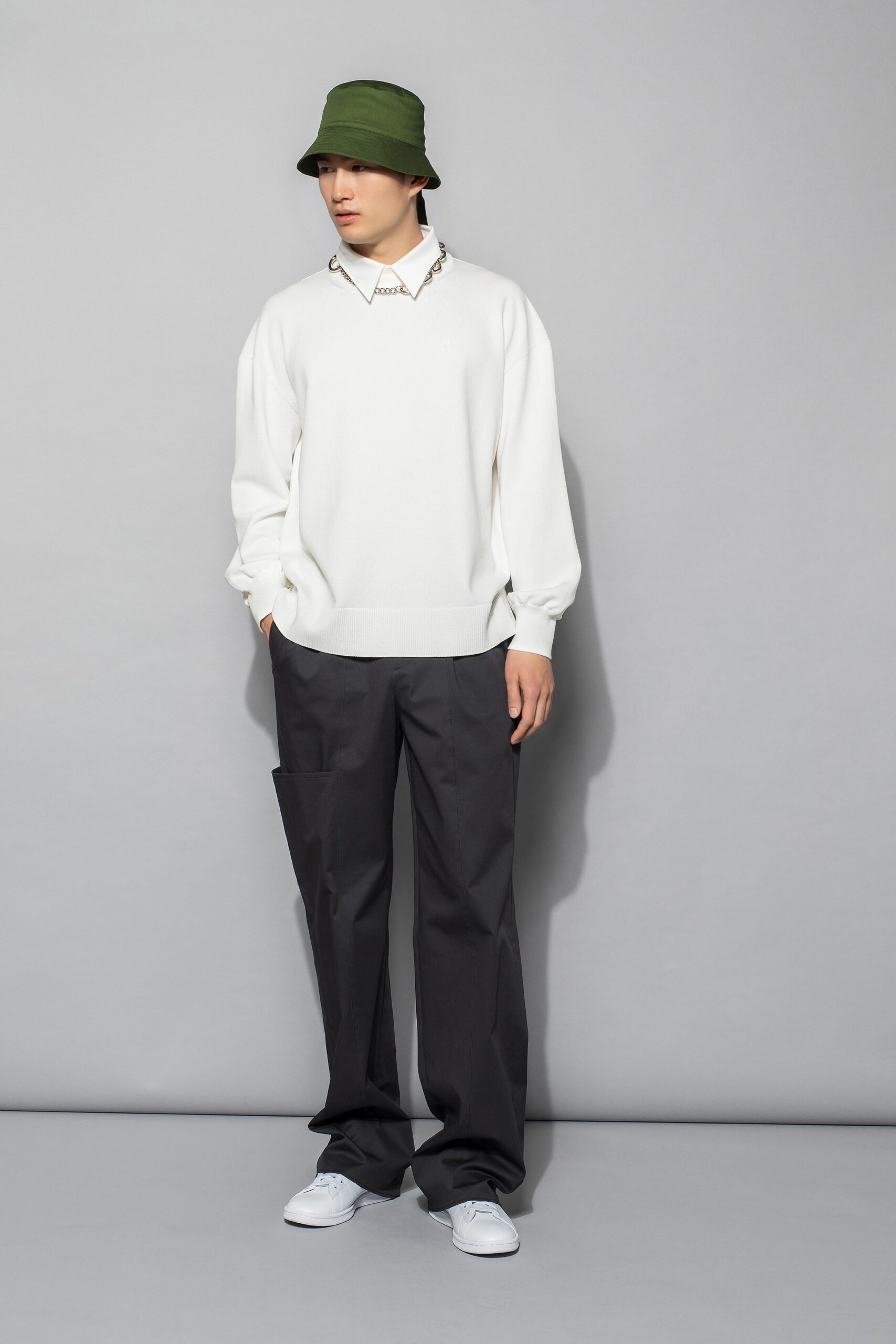 white relaxed sweater with black pants