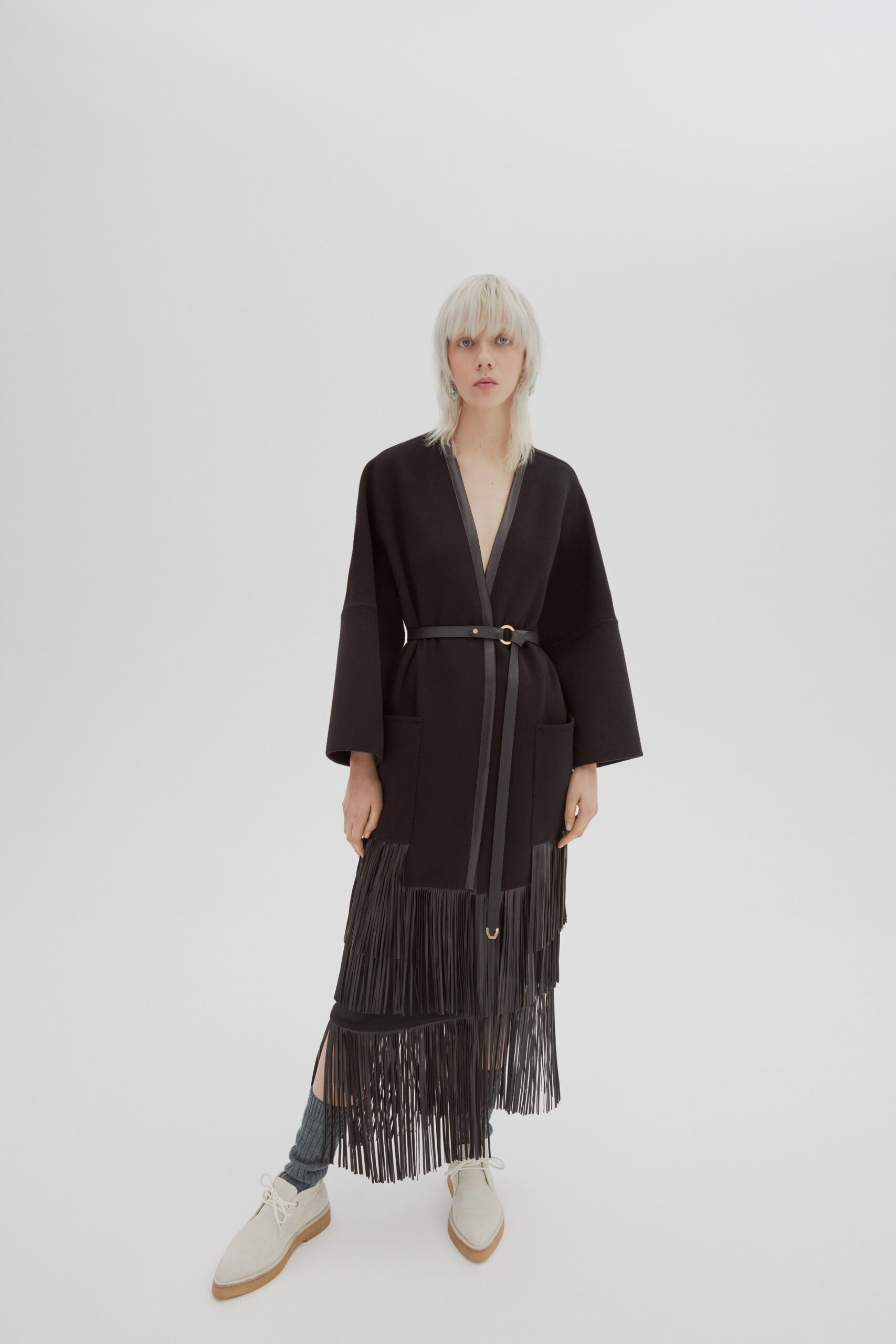 black fringed midi dress with white shoes