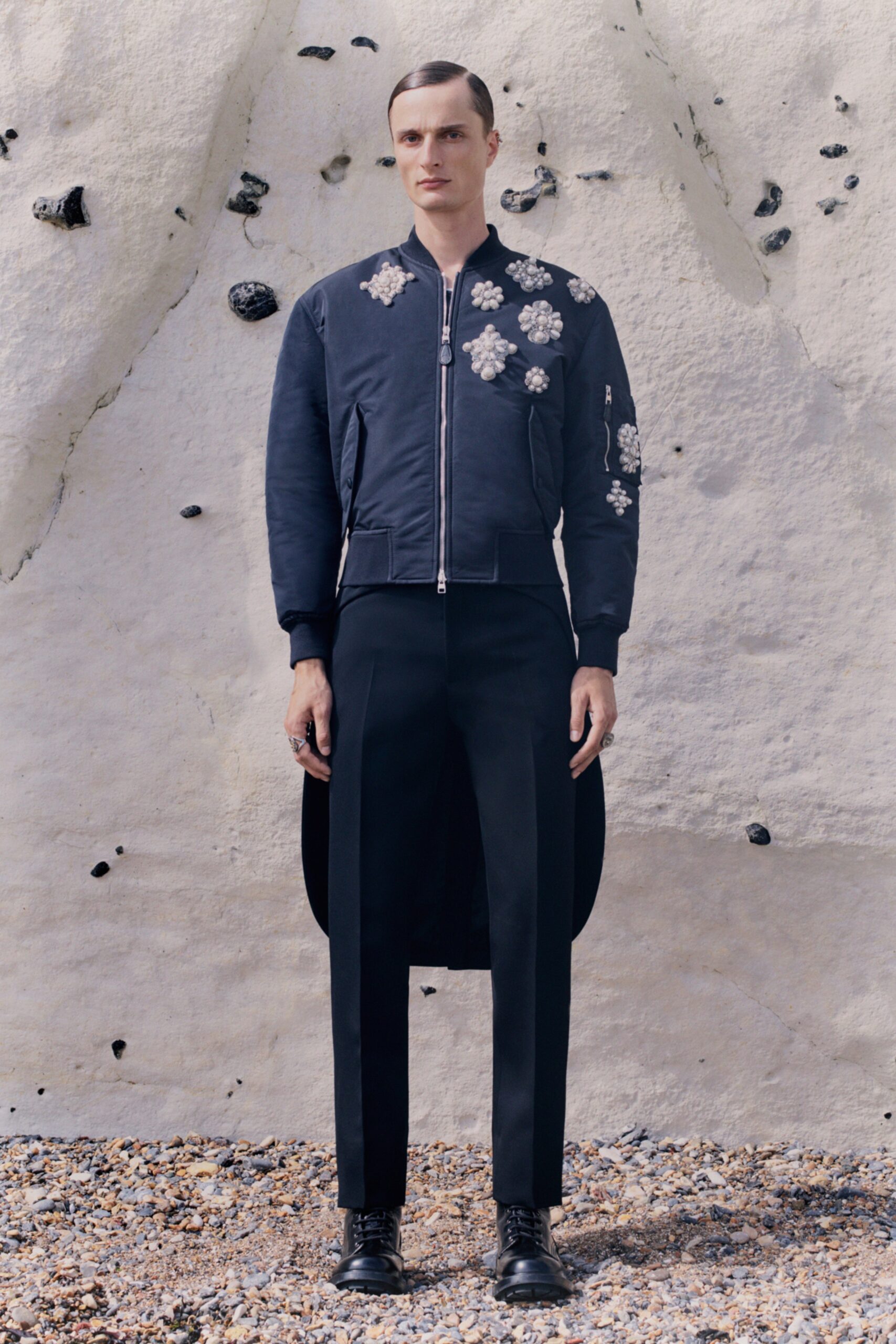 blue embroidered jacket with black pants