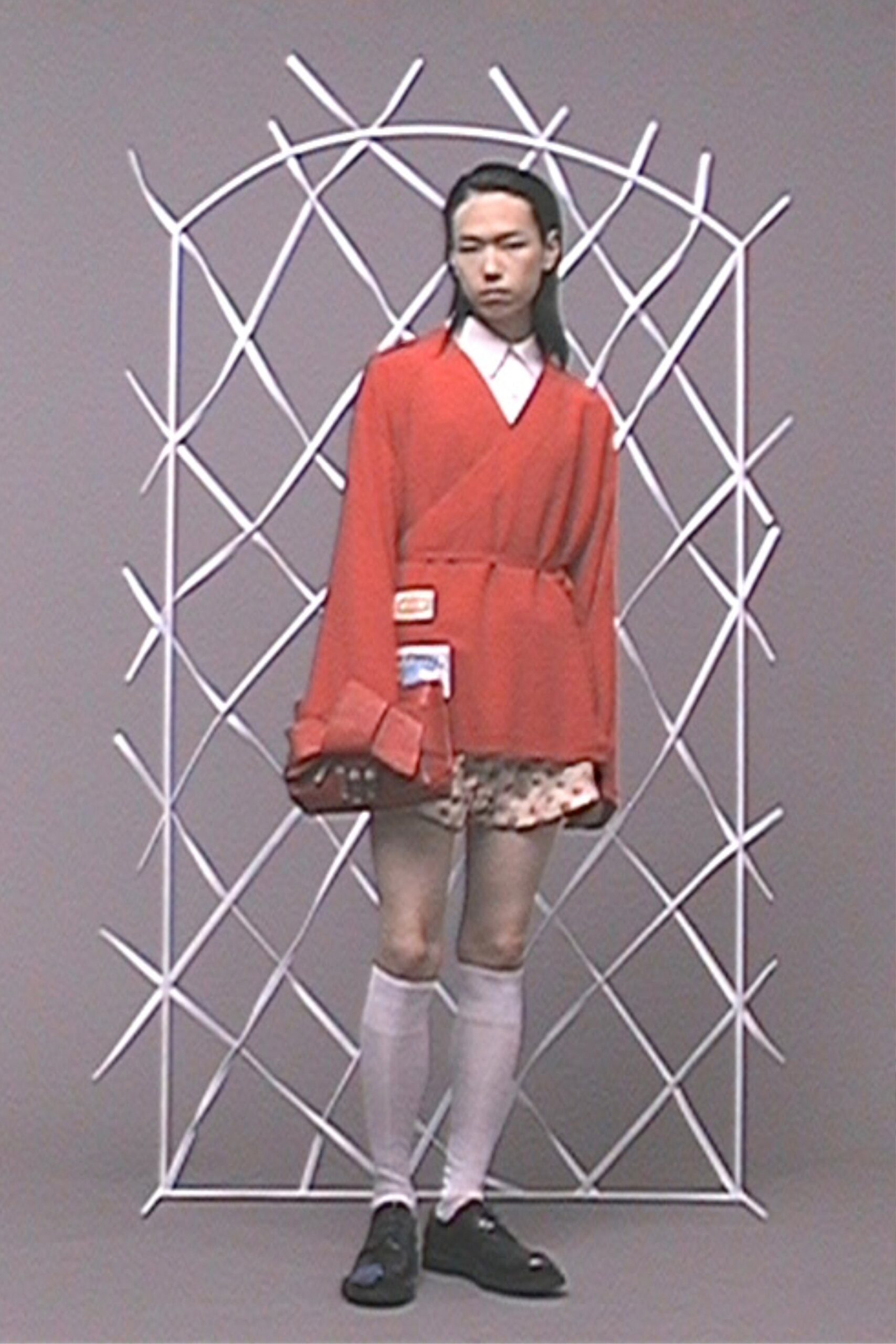 red relaxed jacket with pleated mini skirt