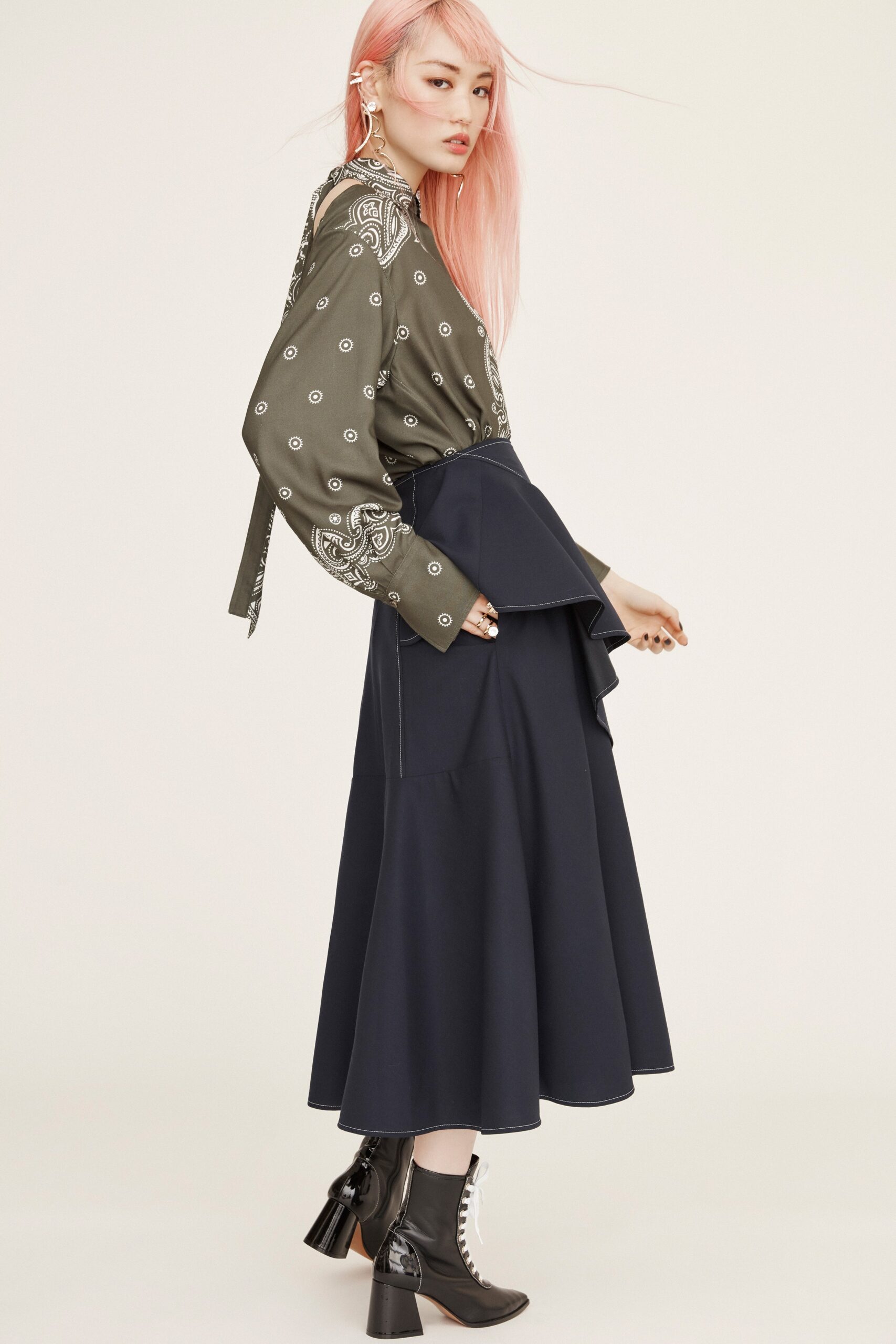 green printed blouse and navy skirt