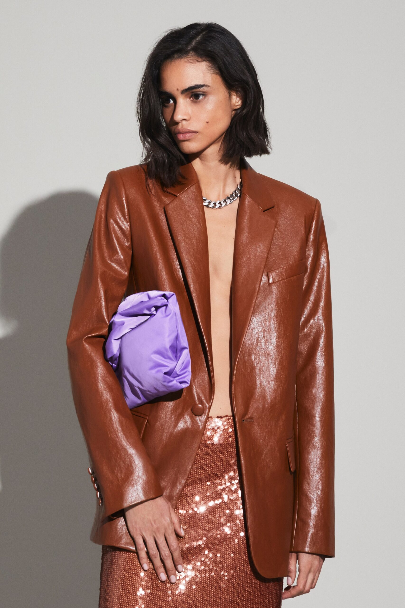brown leather tailored blazer and orange sequin pencil skirt