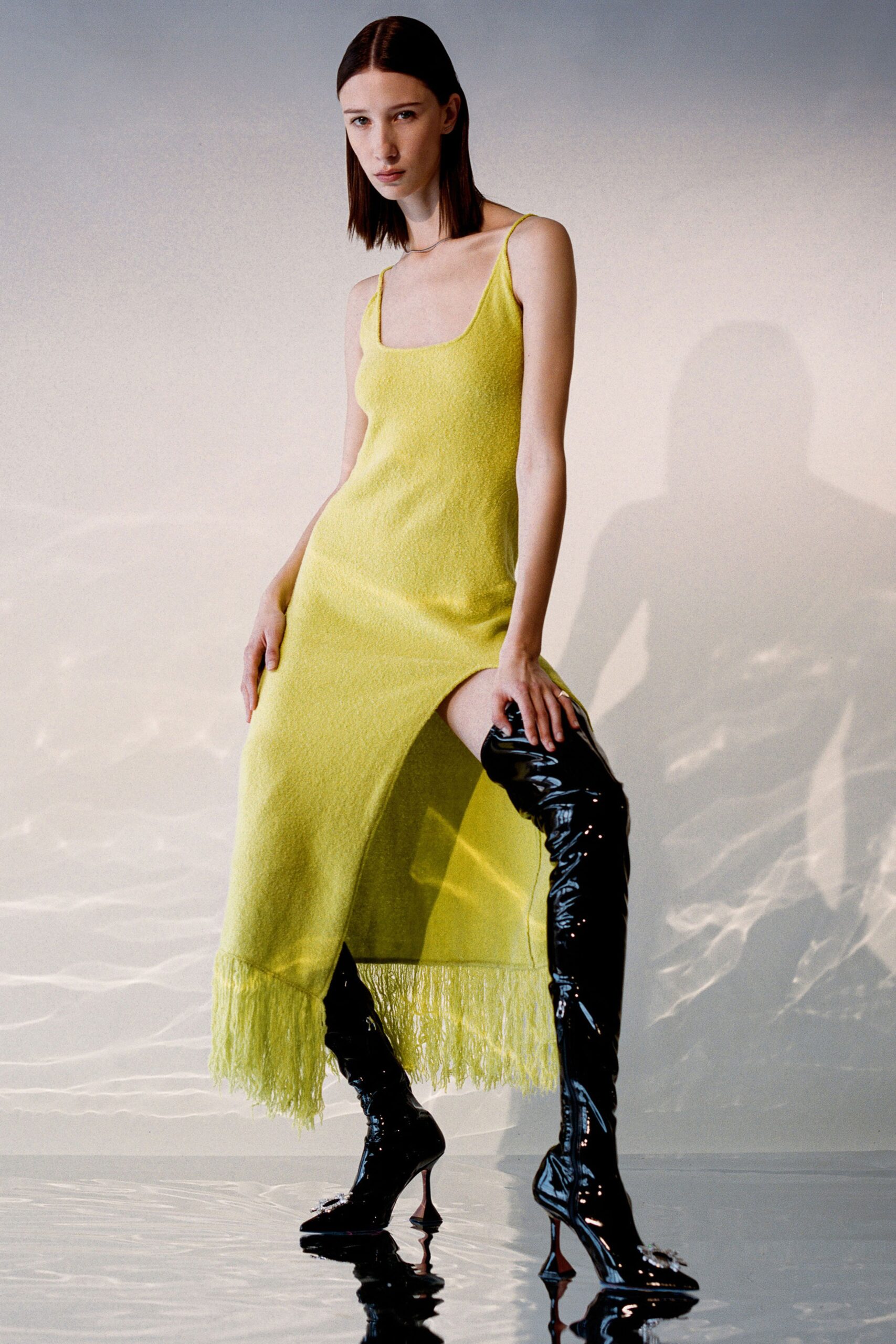 yellow fringed midi dress and black boots