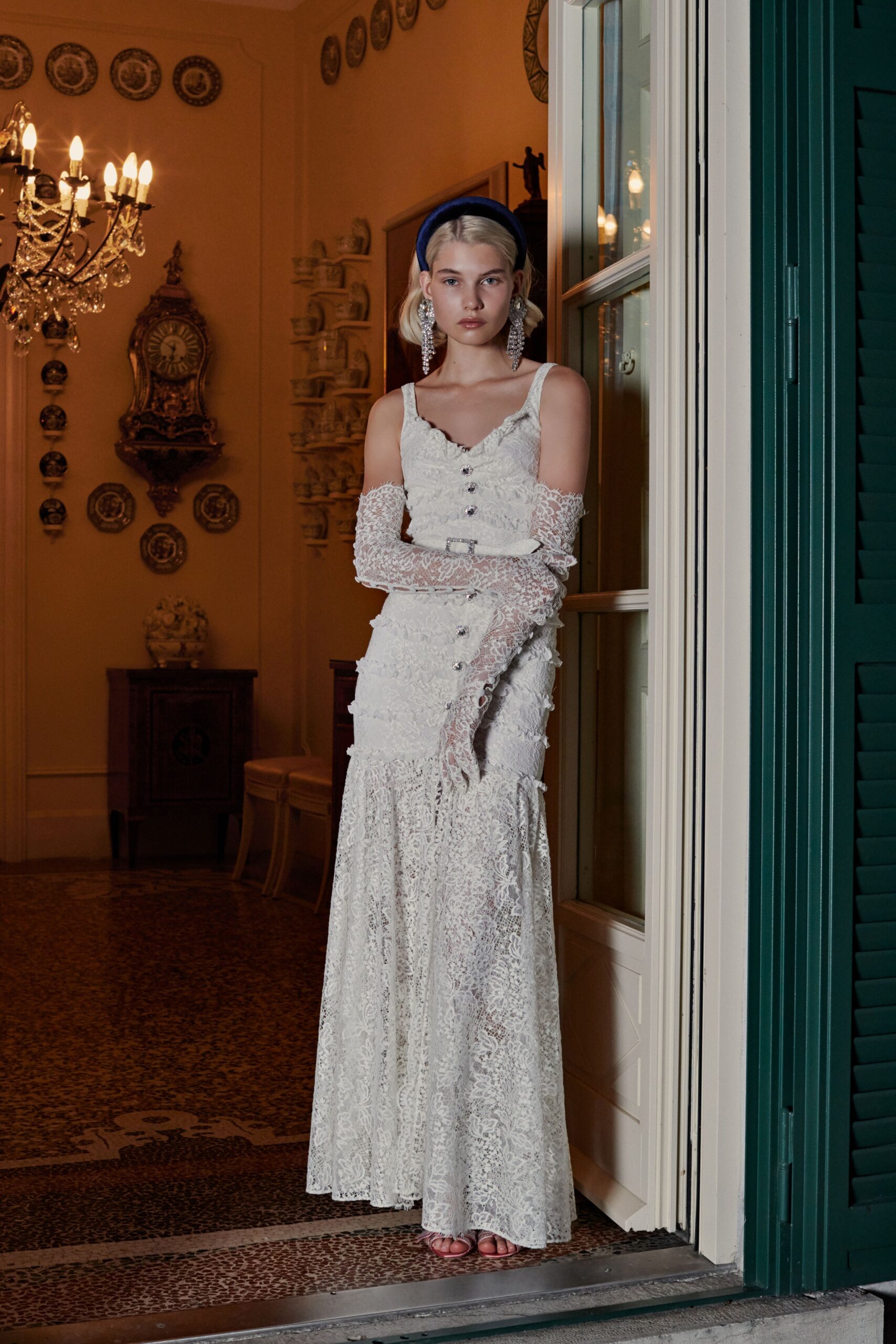 white lace sleeveless v-neck fitted buttoned tiered gown
